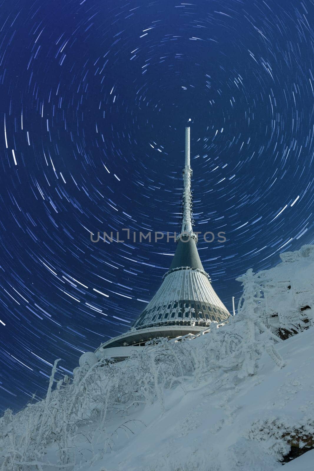 Czech Republic - Liberec - transmitter Jested in winter -with rotating stars. A large white buildingundefined