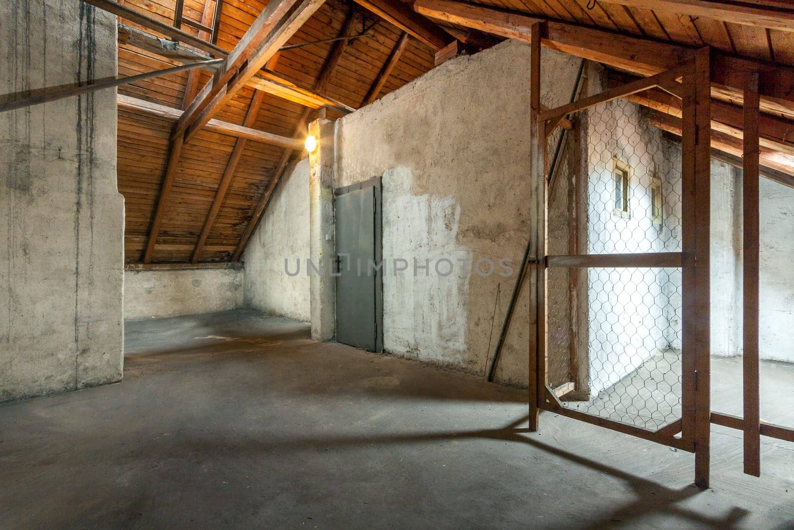 Empty old rustic attic with door. High quality photo