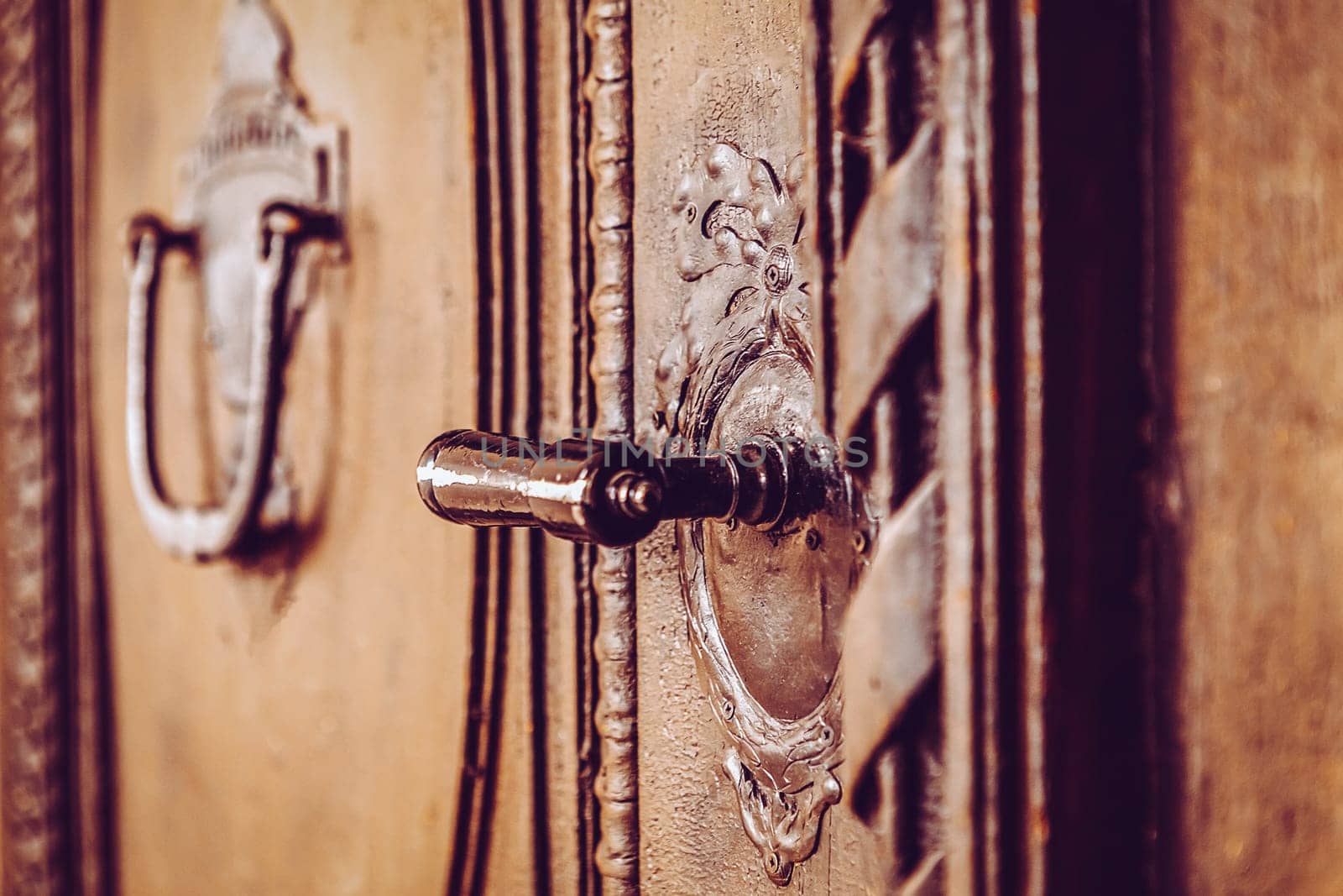 old wooden entrance door with antique door handle - Czech Republic