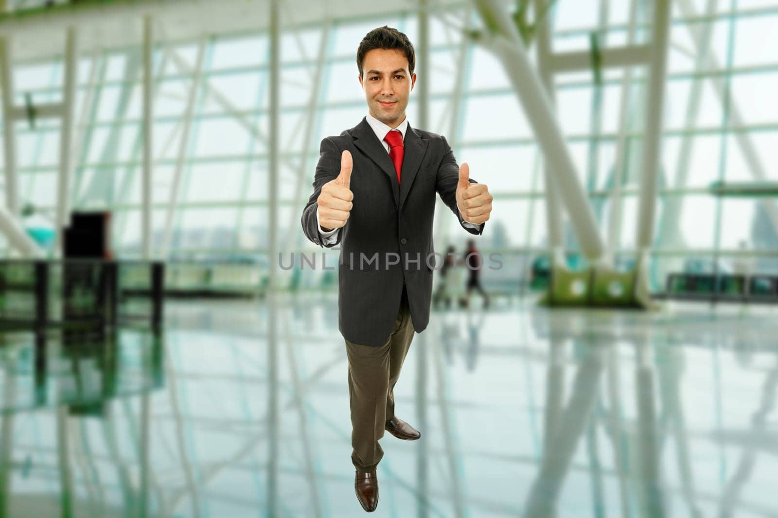business man going thumbs up at the office
