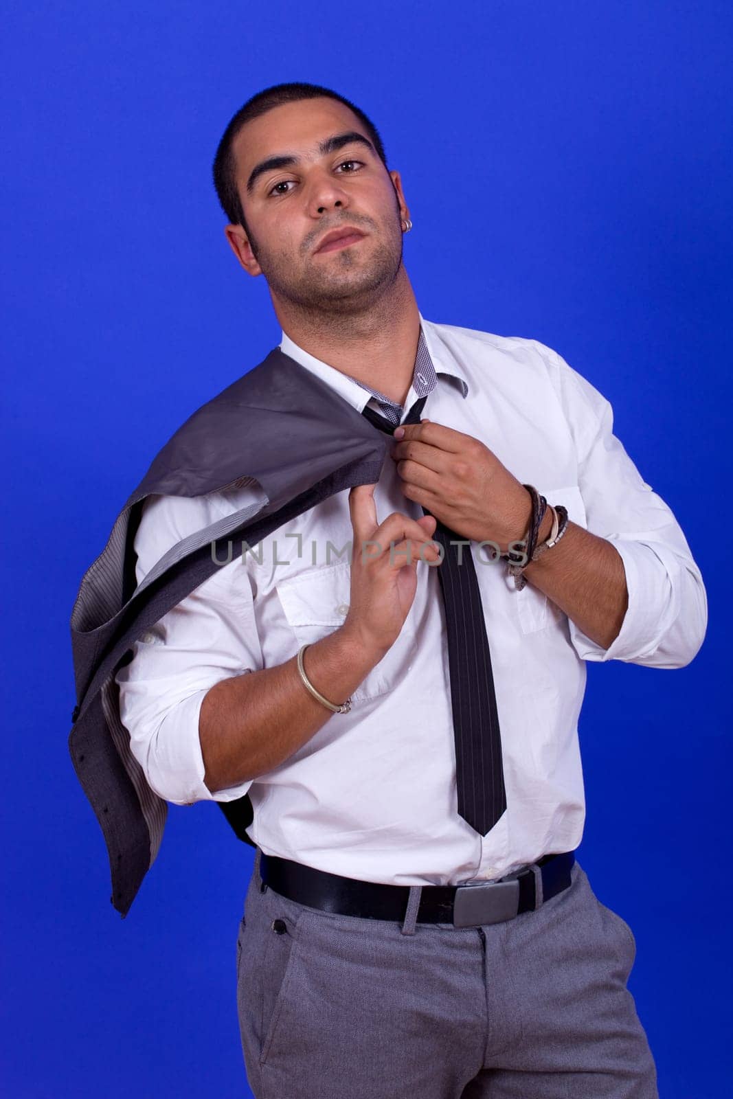 pensive business man portrait on blue background