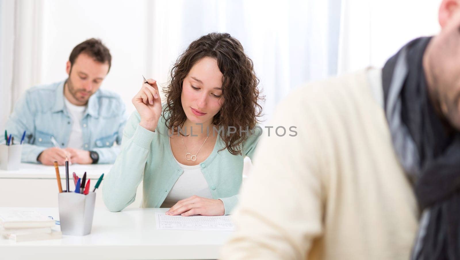 View of a Young attractive student taking exams