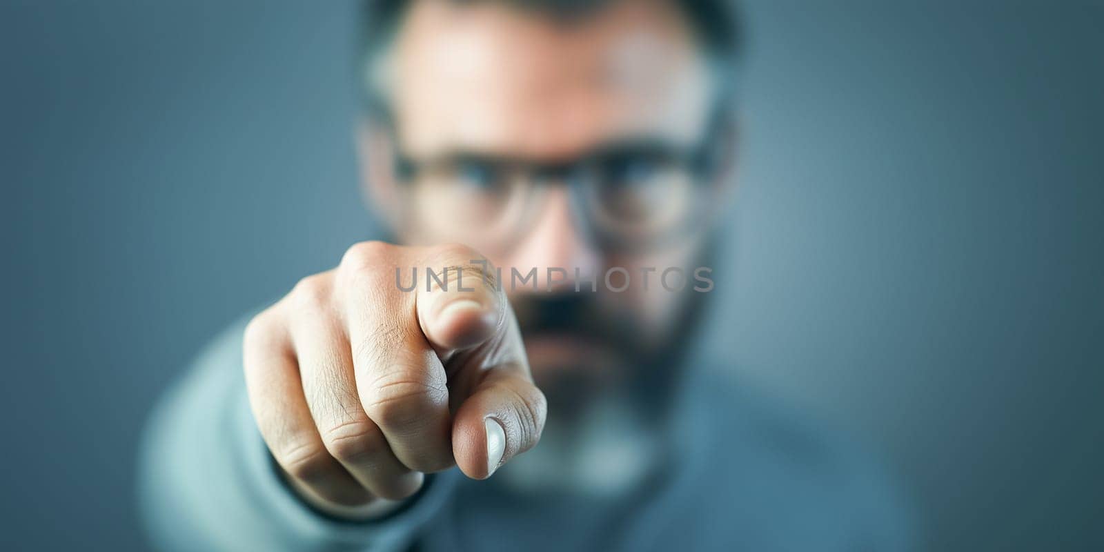 Man points accusingly, likely addressing a specific issue or person. Focus on the finger, not the face.