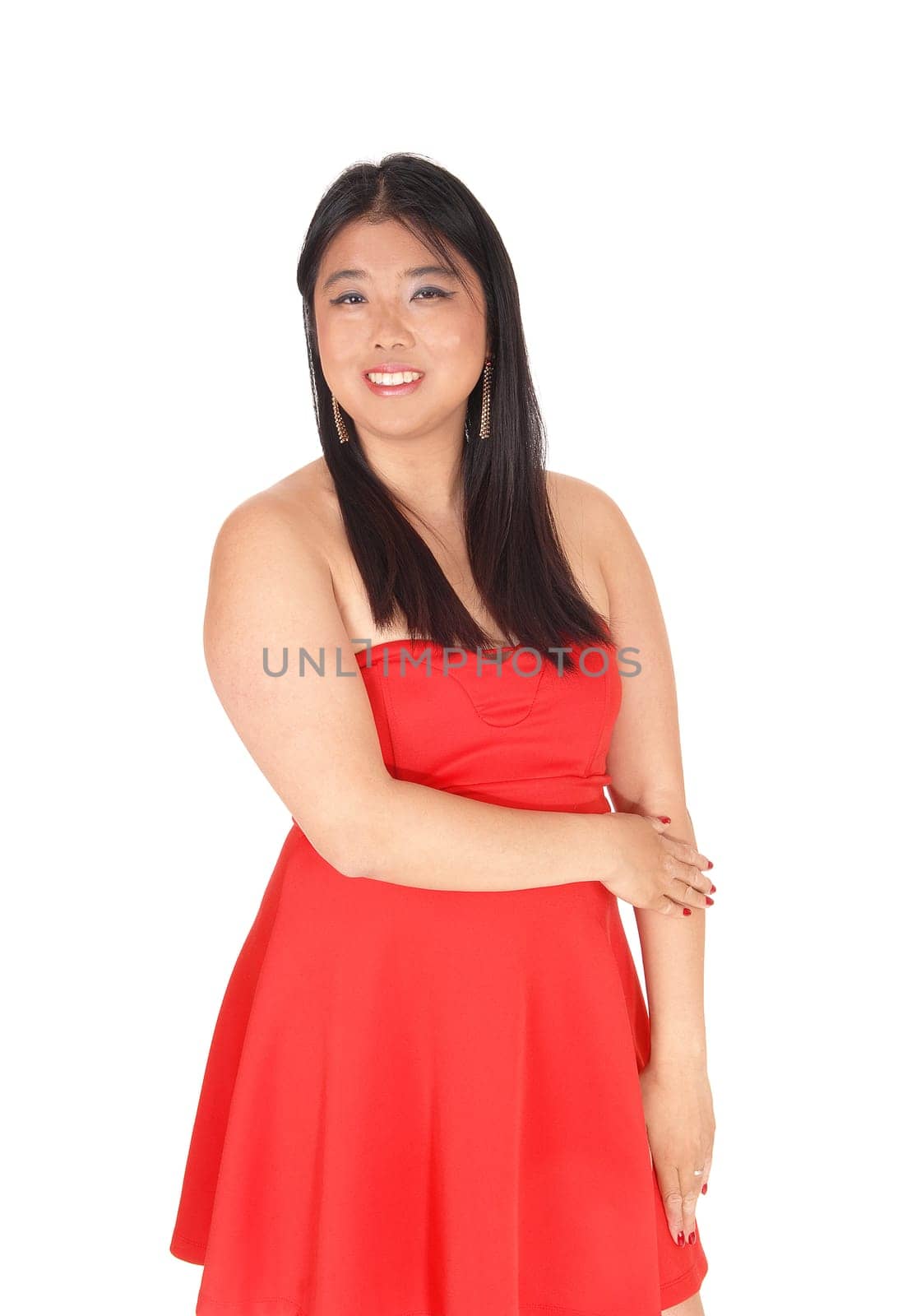 A beautiful young Chinese woman standing from front is a red dress.and long black hair, isolated for white background.