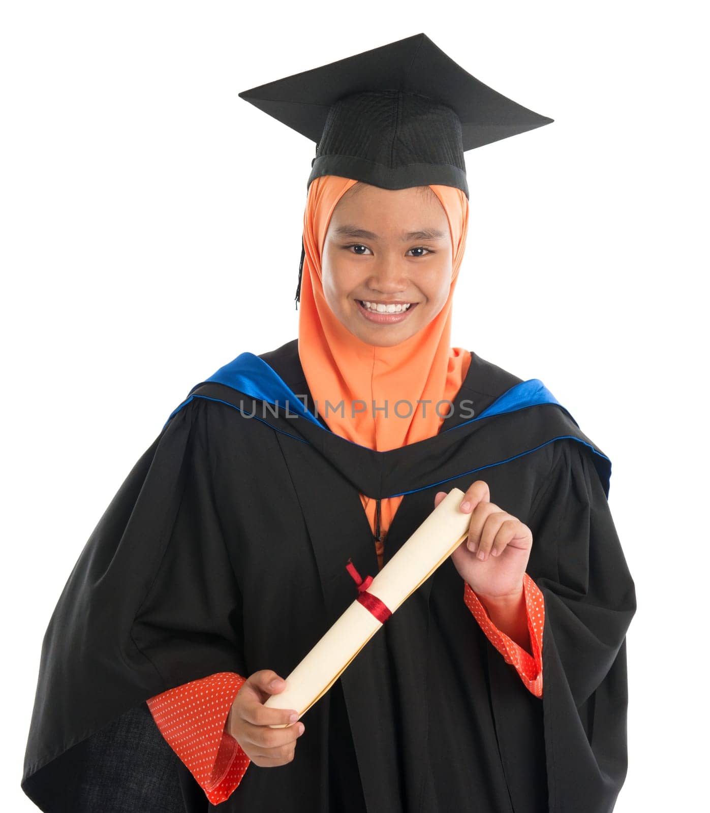 Female student in graduation gown, standing isolated white background.