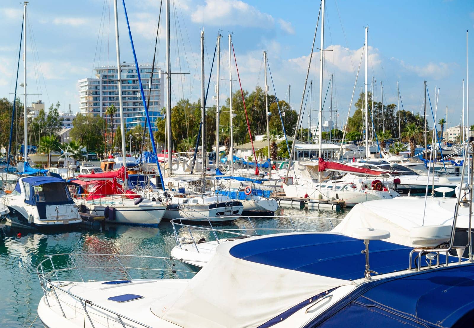 Marina with white yahts and motorboats, Harbour of Laernaca in bright sunlight, Cyprus