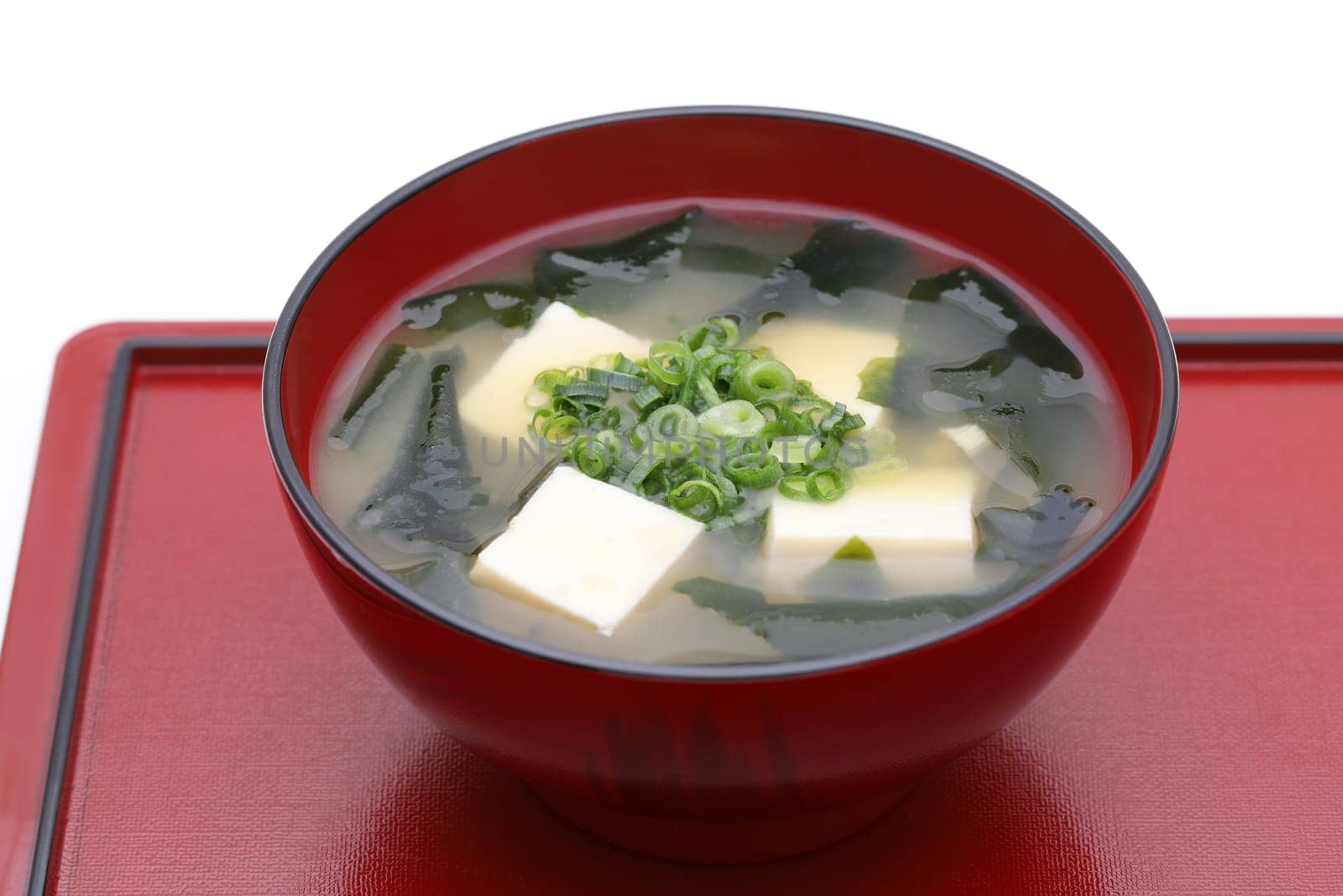 Japanese food, Miso soup of tofu and seaweed wakame in a bowl on tray