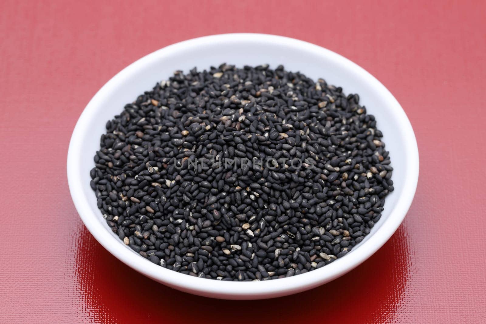 black sesame seeds in a bowl on table