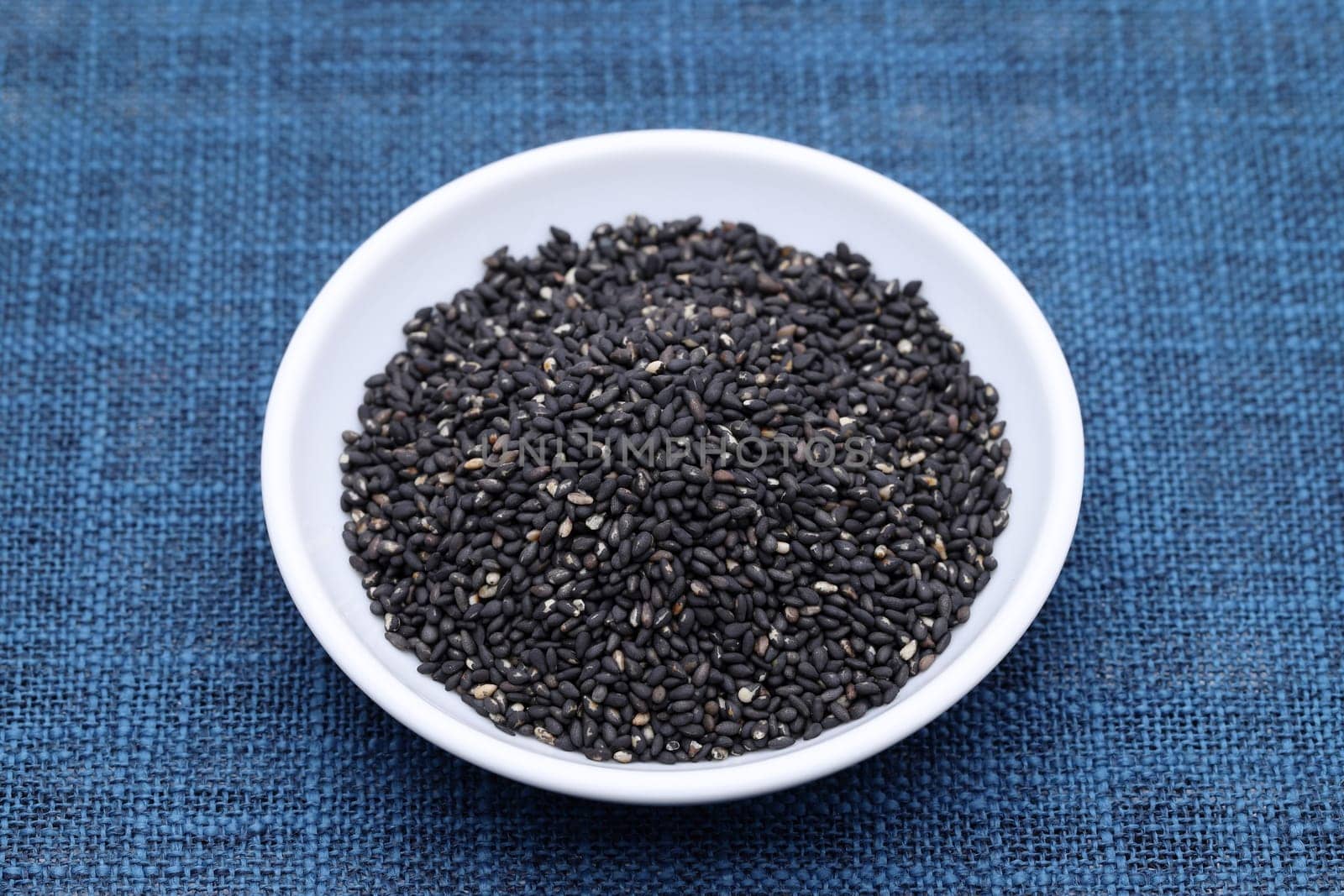 black sesame seeds in a bowl on table