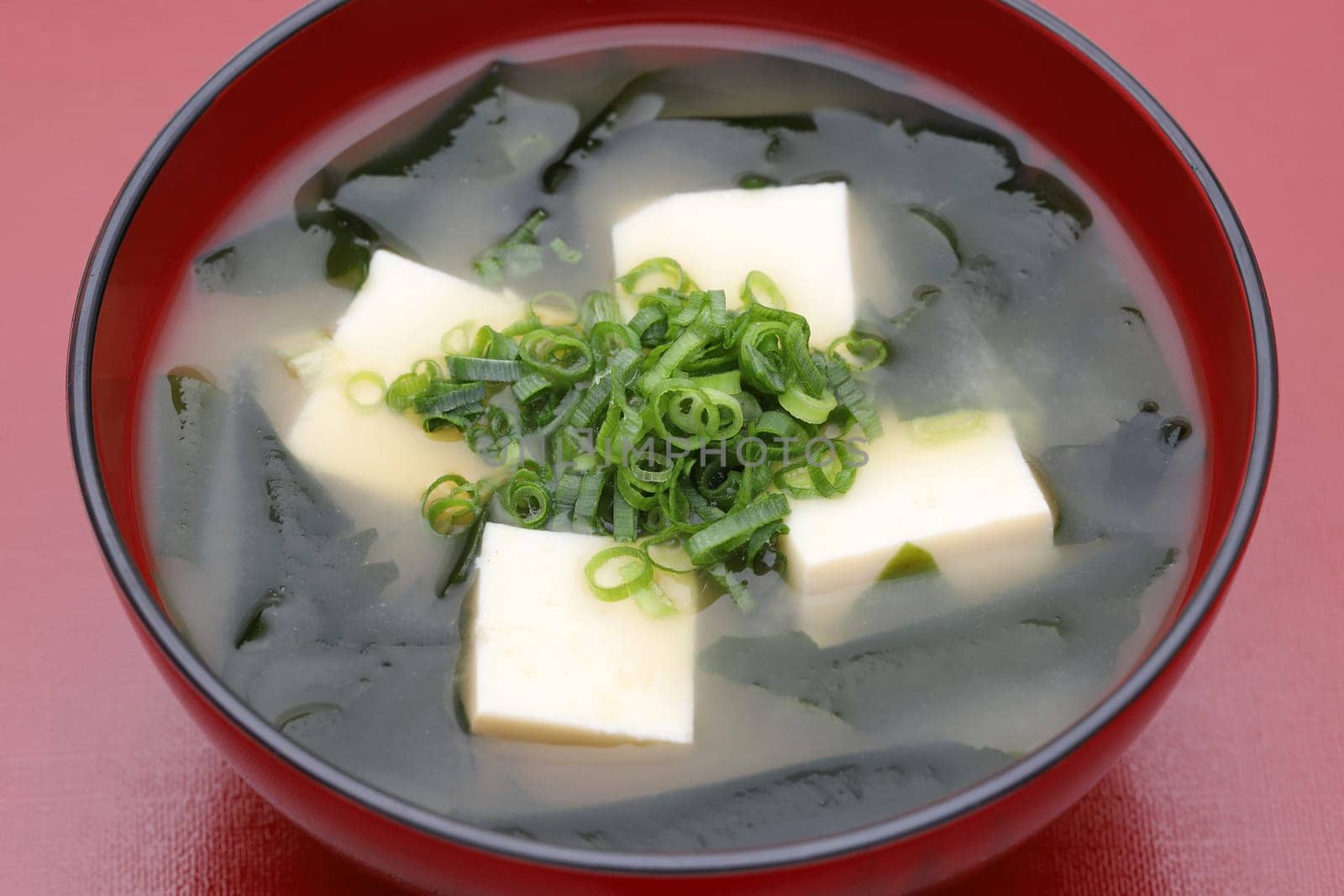 Japanese food, Miso soup of tofu and seaweed wakame in a bowl on table