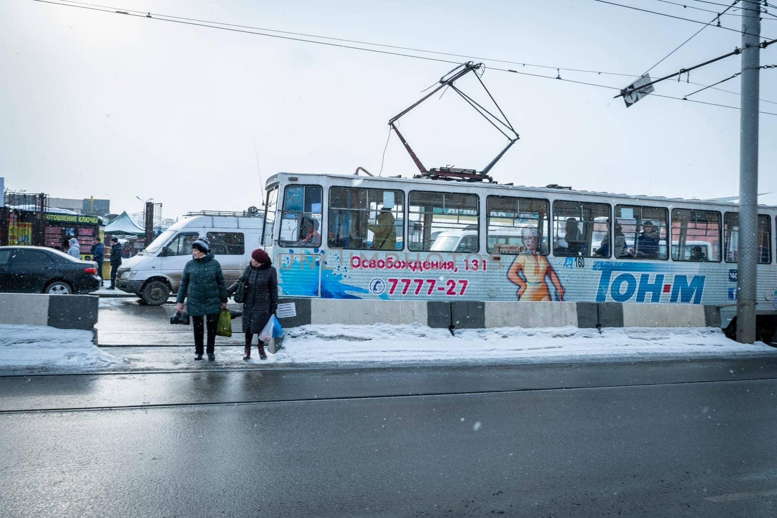IRKUTSK, RUSSIA - FEBUARY 26, 2020 : View of streets and the subway of Irkutsk city downtown by winter. Irkoutsk is the capital of Siberia in Russia.