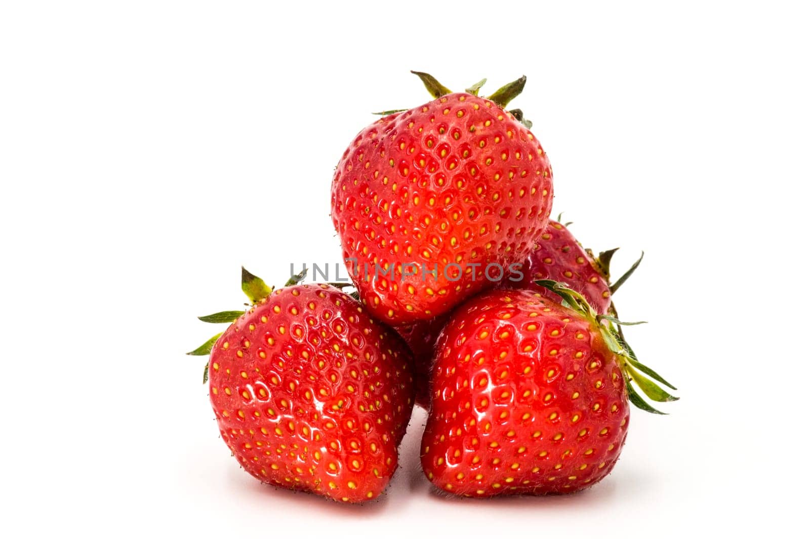 Closeup shot of fresh strawberries. Isolated on white background.