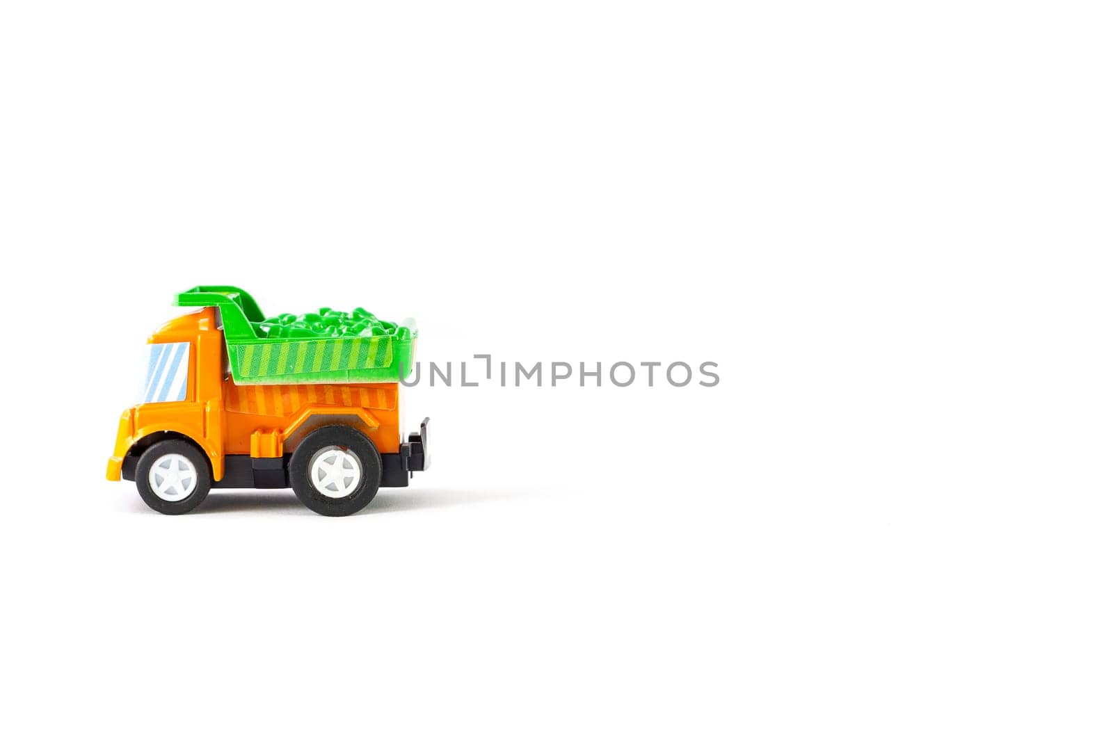 Earth moving toy. Orange and Green truck.