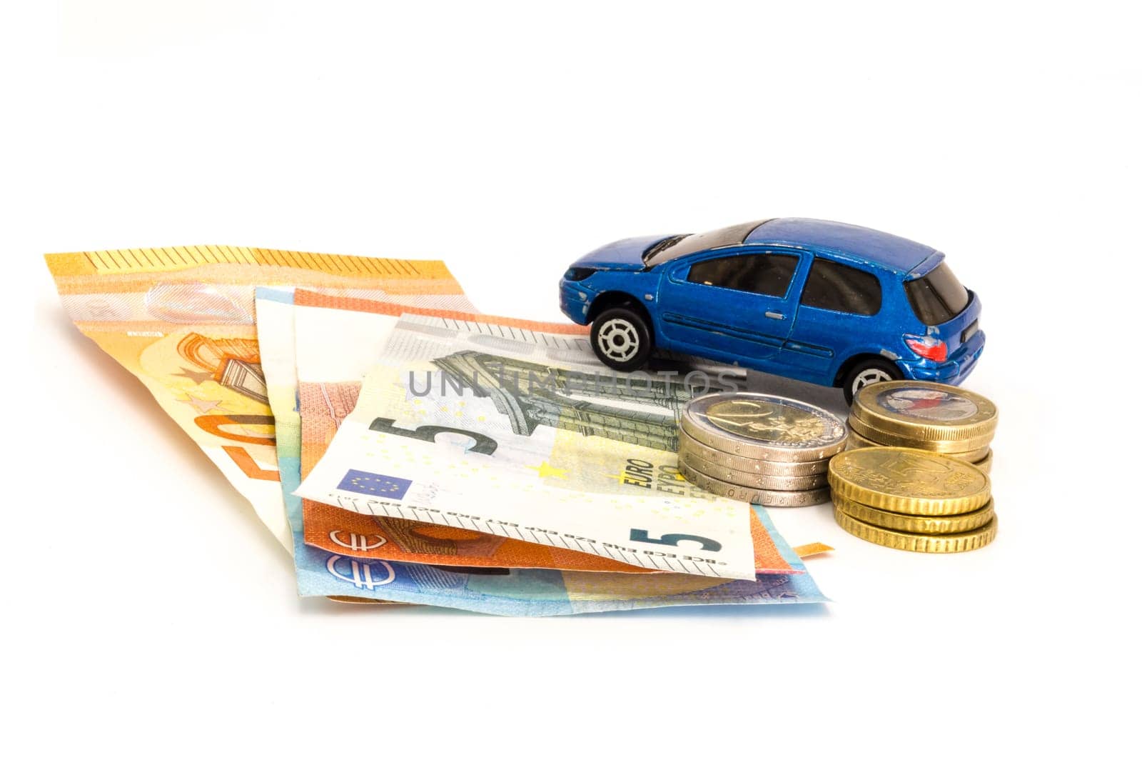 Stacks of giant silver coins and banknotes next to a blue used car