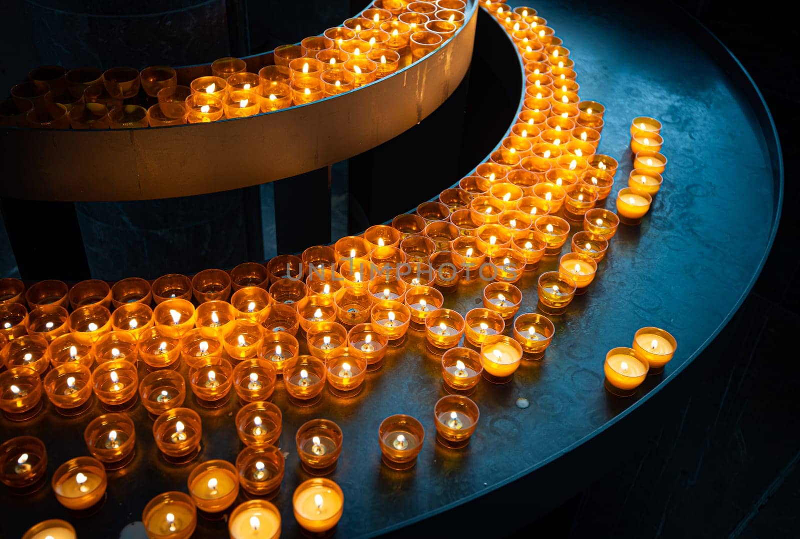 Candles in church of Wurzburg, Bavaria, Germany. Religion and christianity attributes