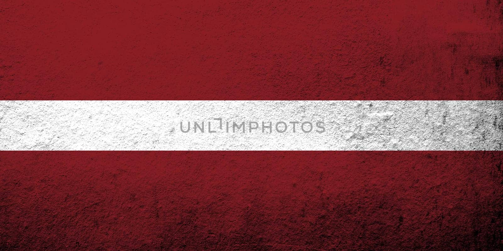 The Republic of Latvia National flag. Grunge background