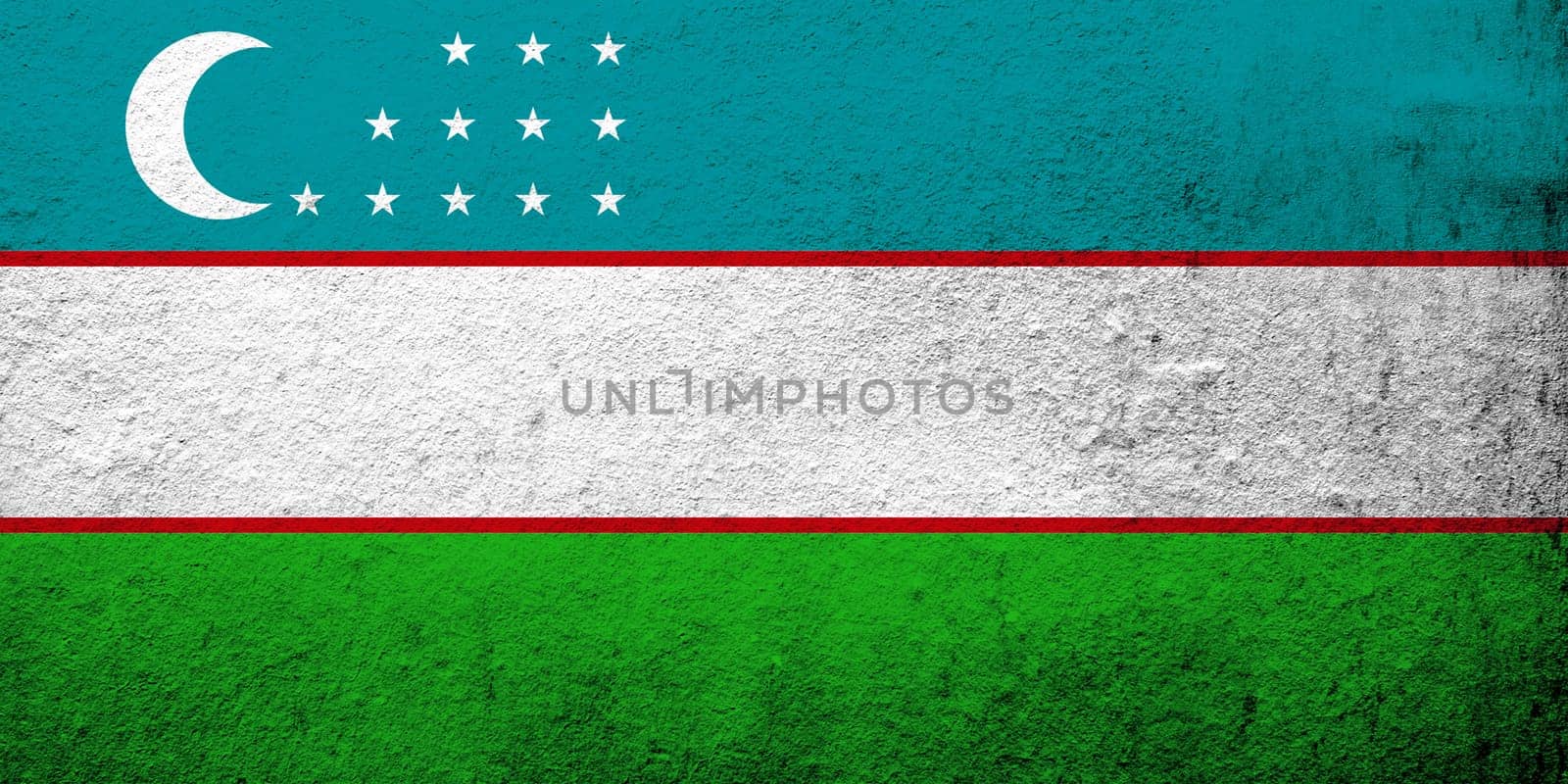 The Republic of Uzbekistan National flag. Grunge background
