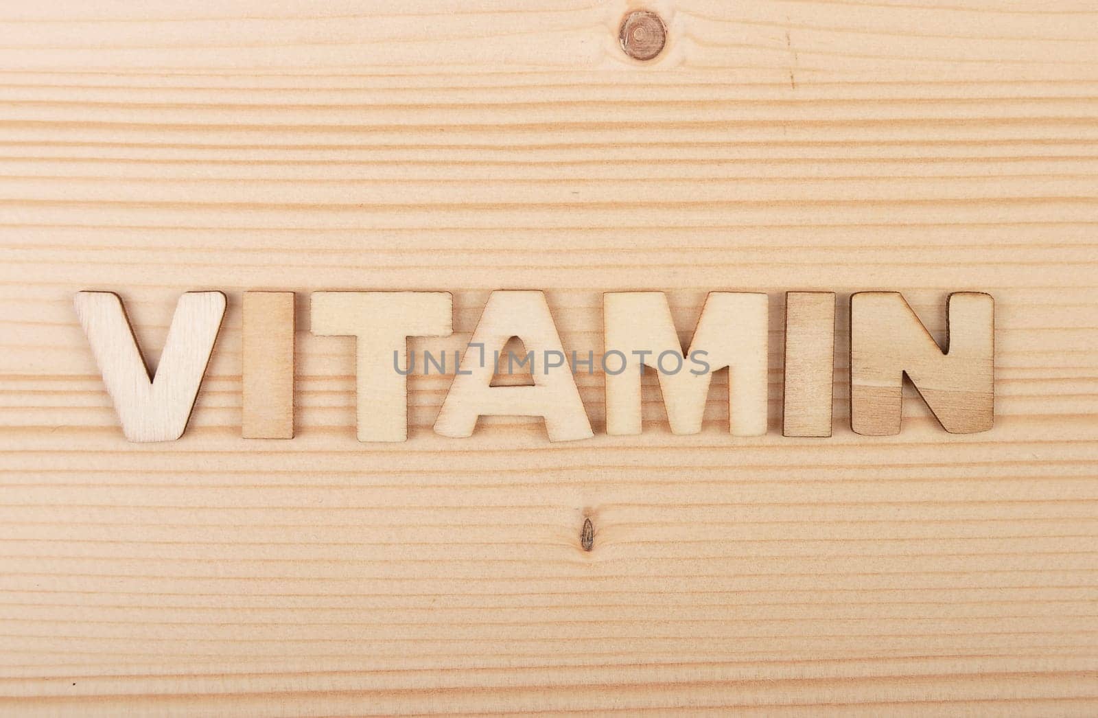 Term from wooden letters on pale wood