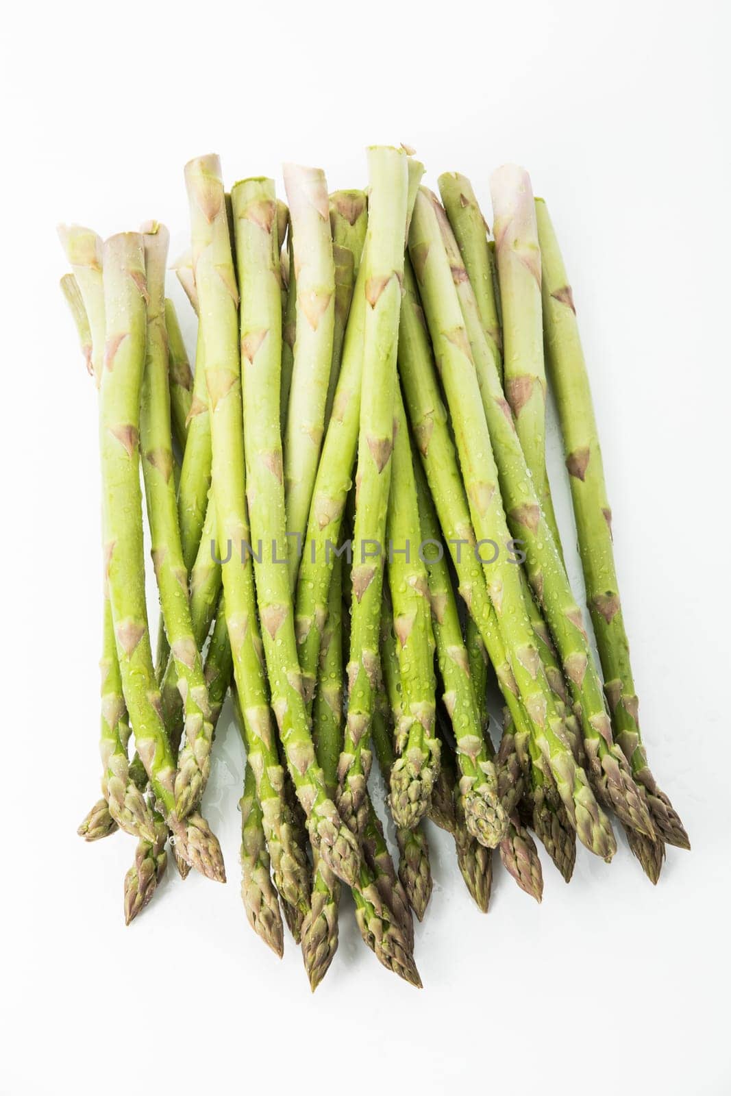 green asparagus on white background
