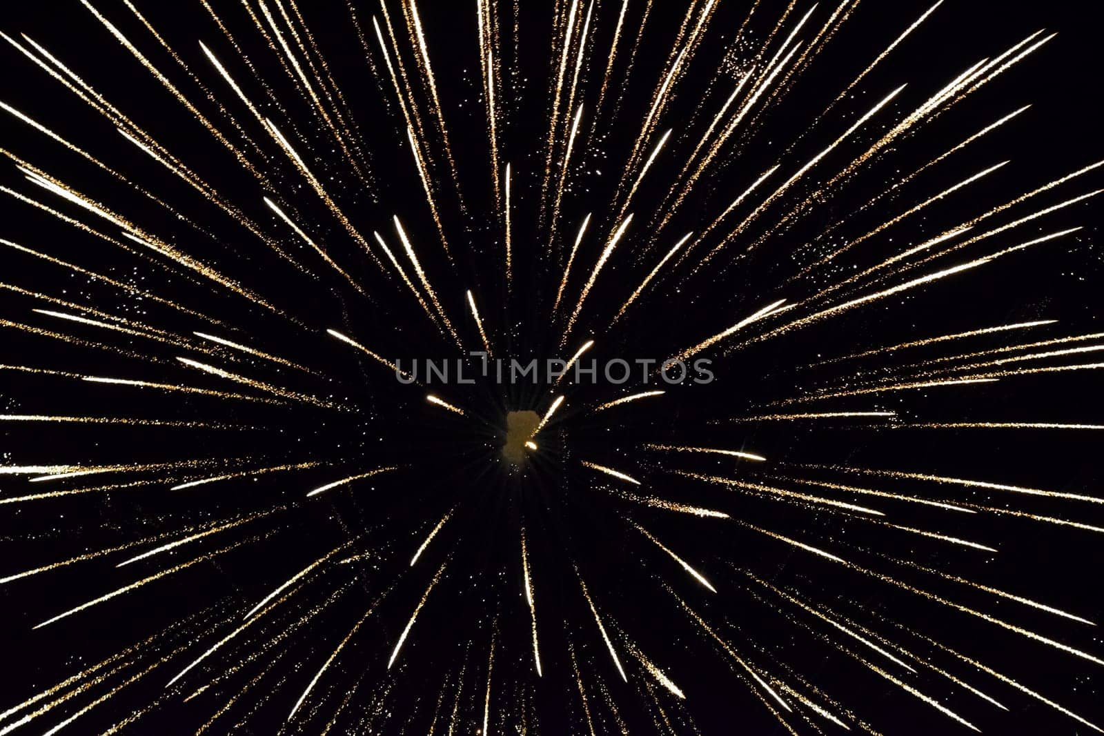 Festive salute in the night sky. Explosions of fireworks and pyrotechnics in the sky.