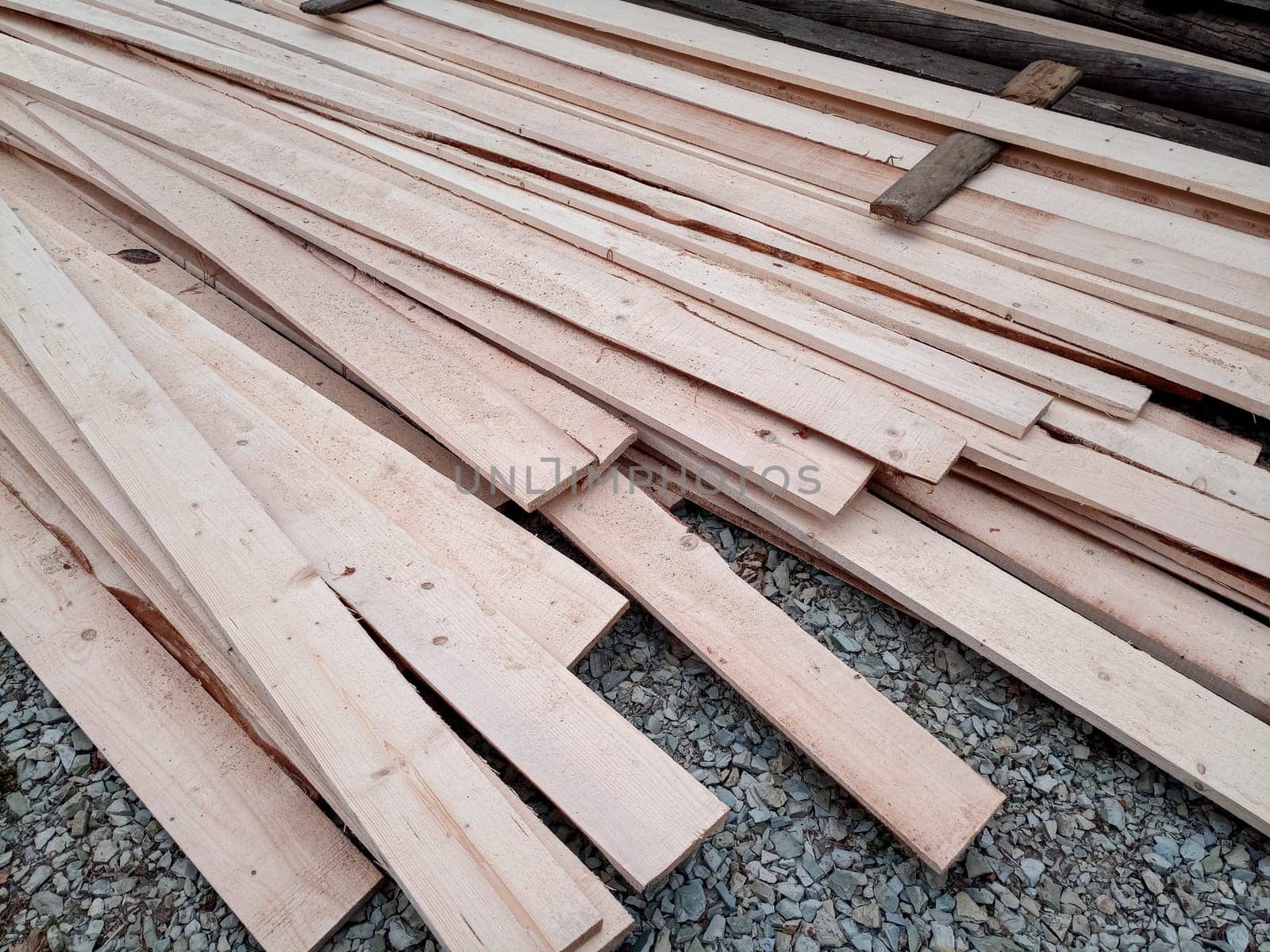 Boards with a sawmill. Building material from wood, boards for construction.