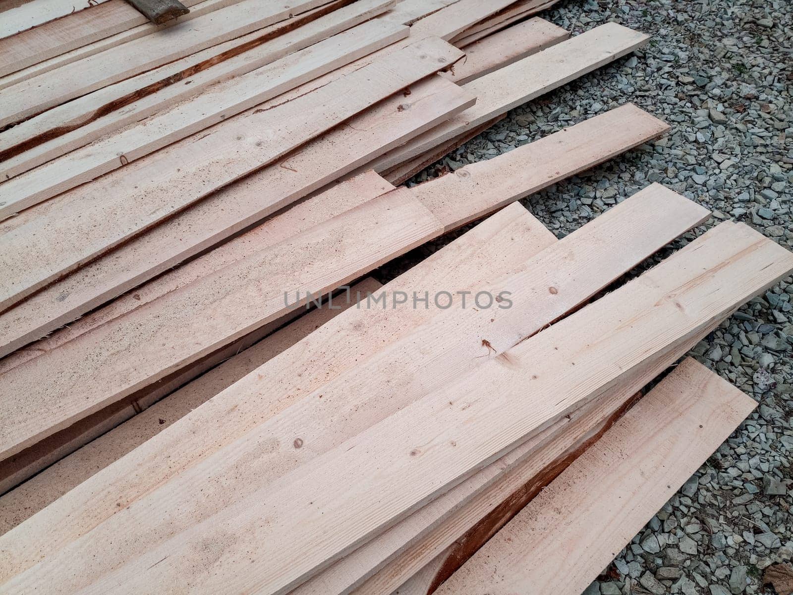 Boards with a sawmill. Building material from wood, boards for construction.