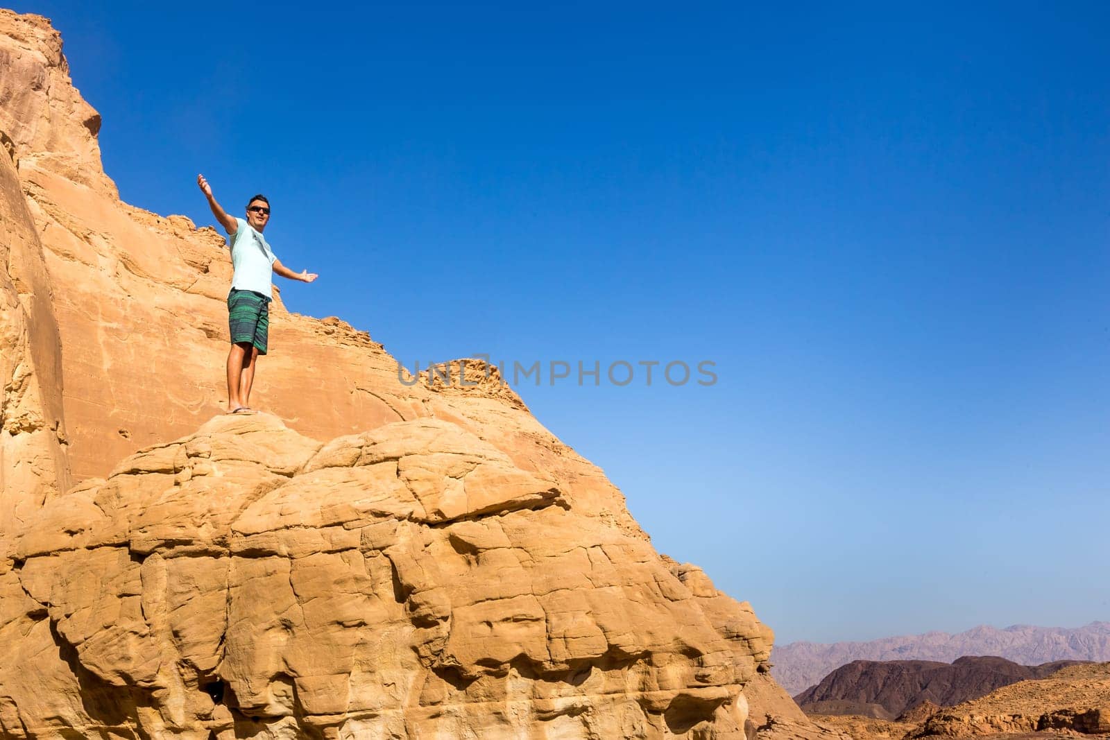 Man with open arms. Holy trip through the historic cities of Israel