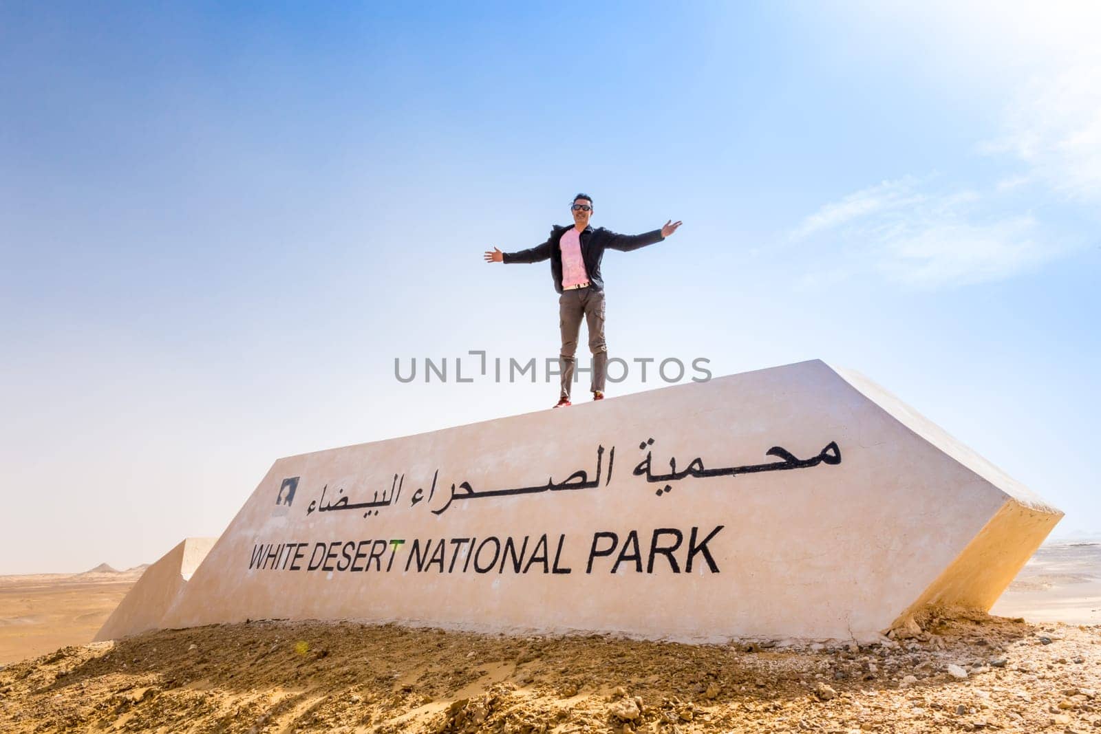 Man with open arms in the White Desert, Egypt.