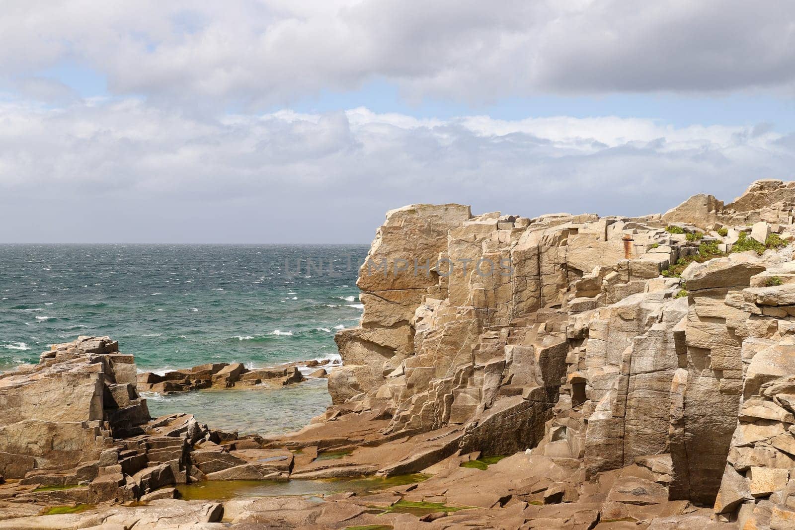 Cliffs on the coast of the Ile Grande - Big Island - in Pleumeur-Bodou in Brittany, France