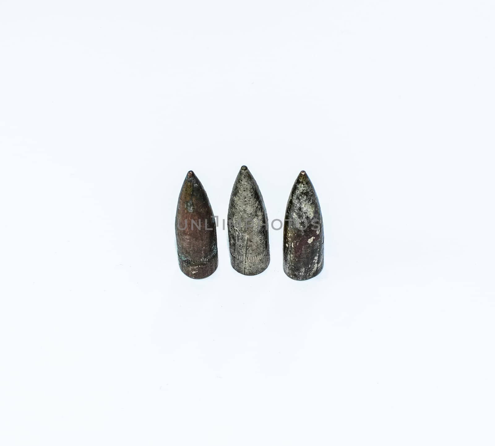 Old rusty bullets from a Kalashnikov assault rifle.