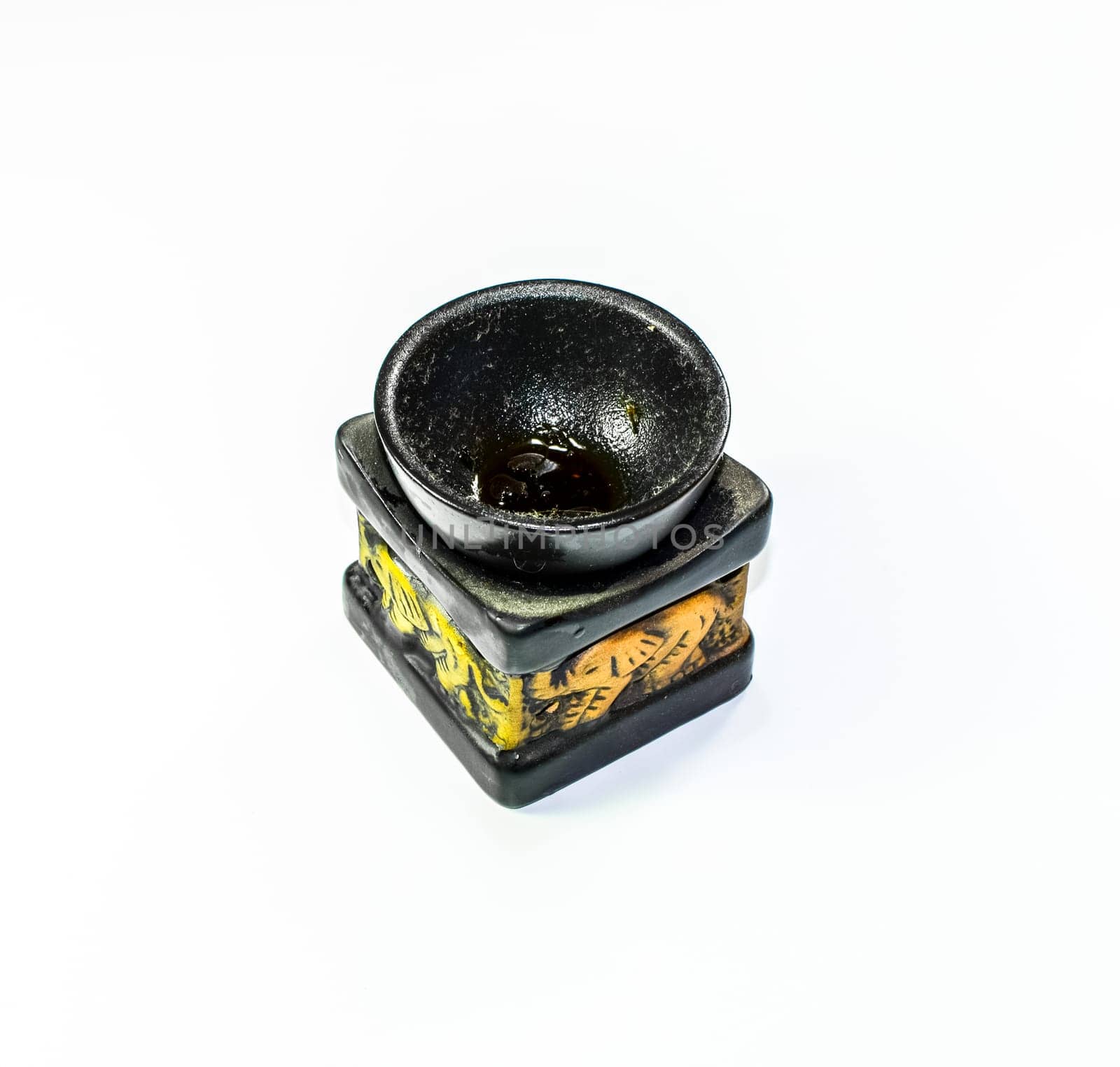 An ashtray carved from black stone. Creative of stone.