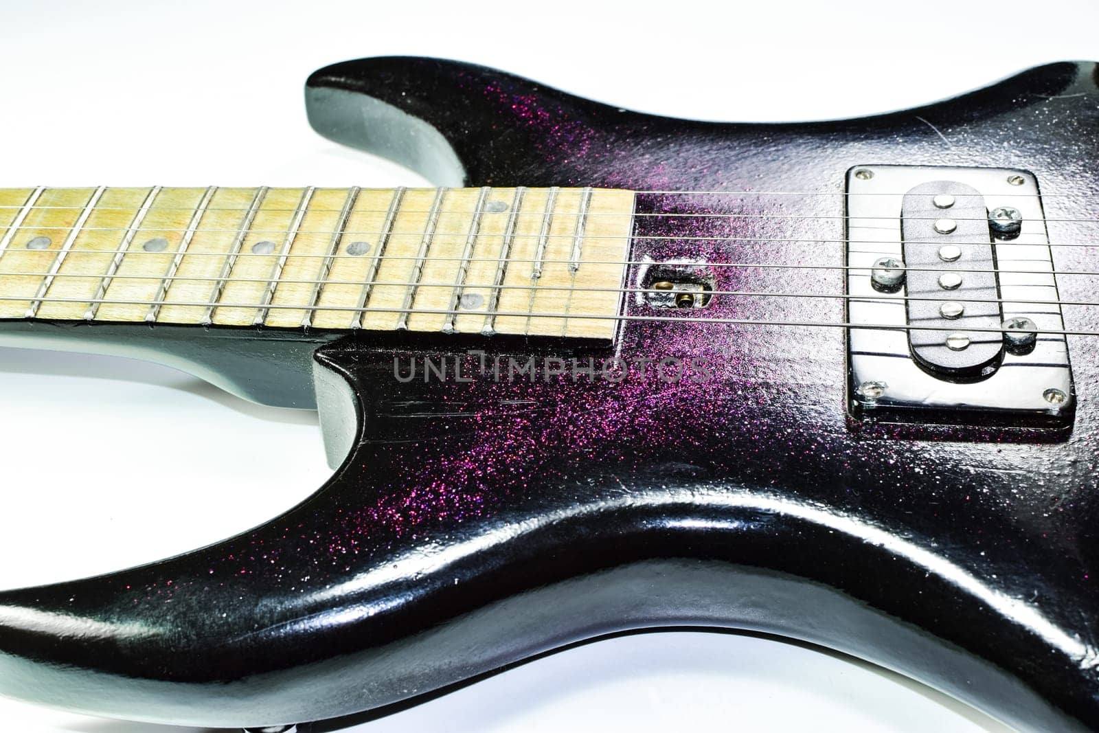 Electric guitar on a white background. A musical instrument.