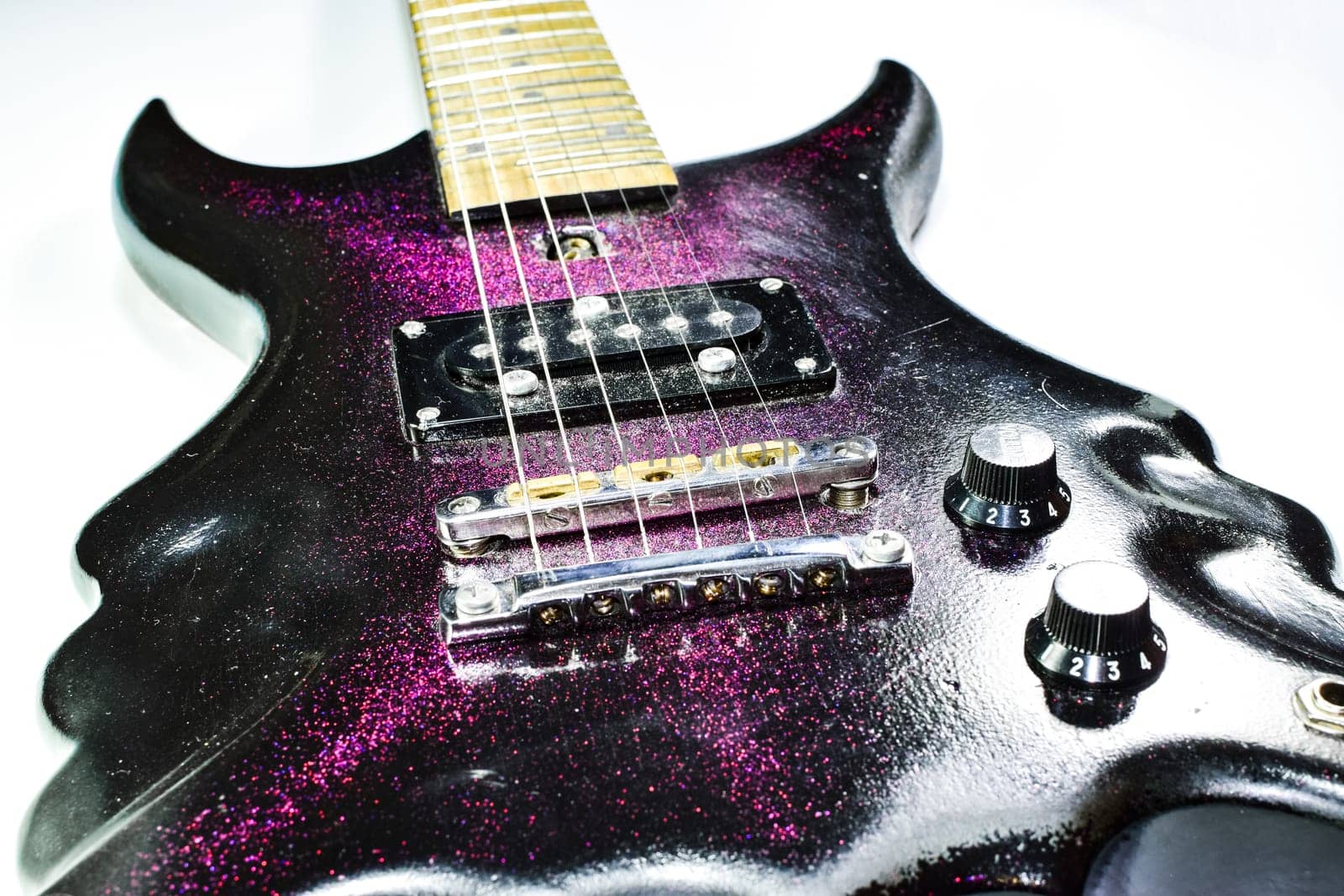 Electric guitar on a white background. A musical instrument.