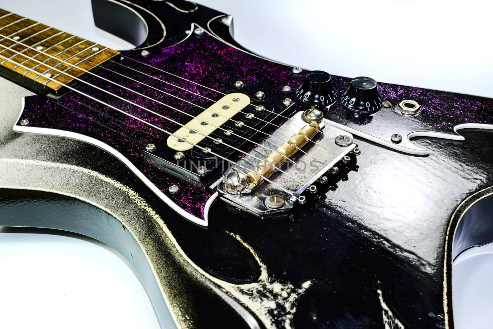 Electric guitar on a white background. A musical instrument.