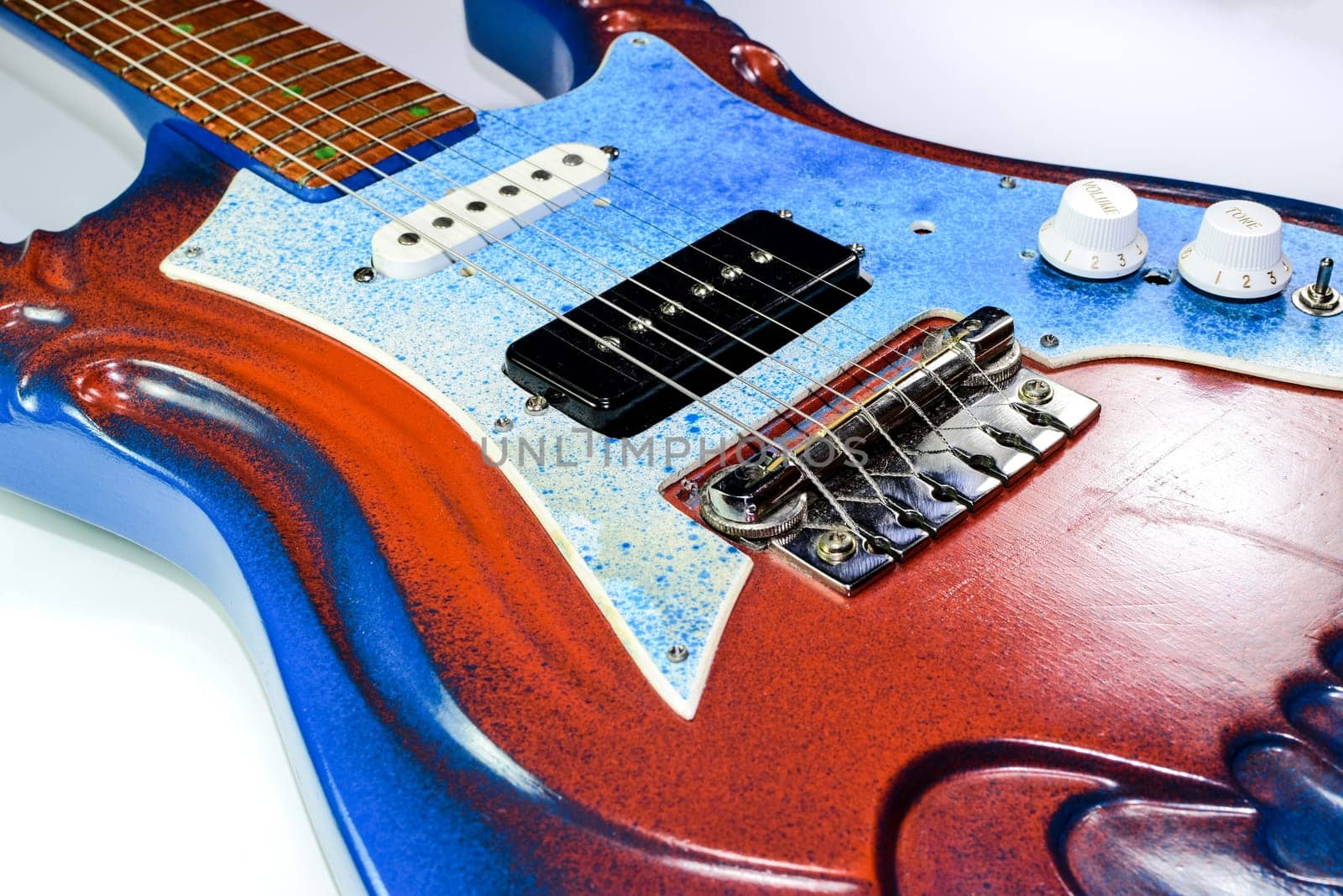 Electric guitar on a white background. A musical instrument.