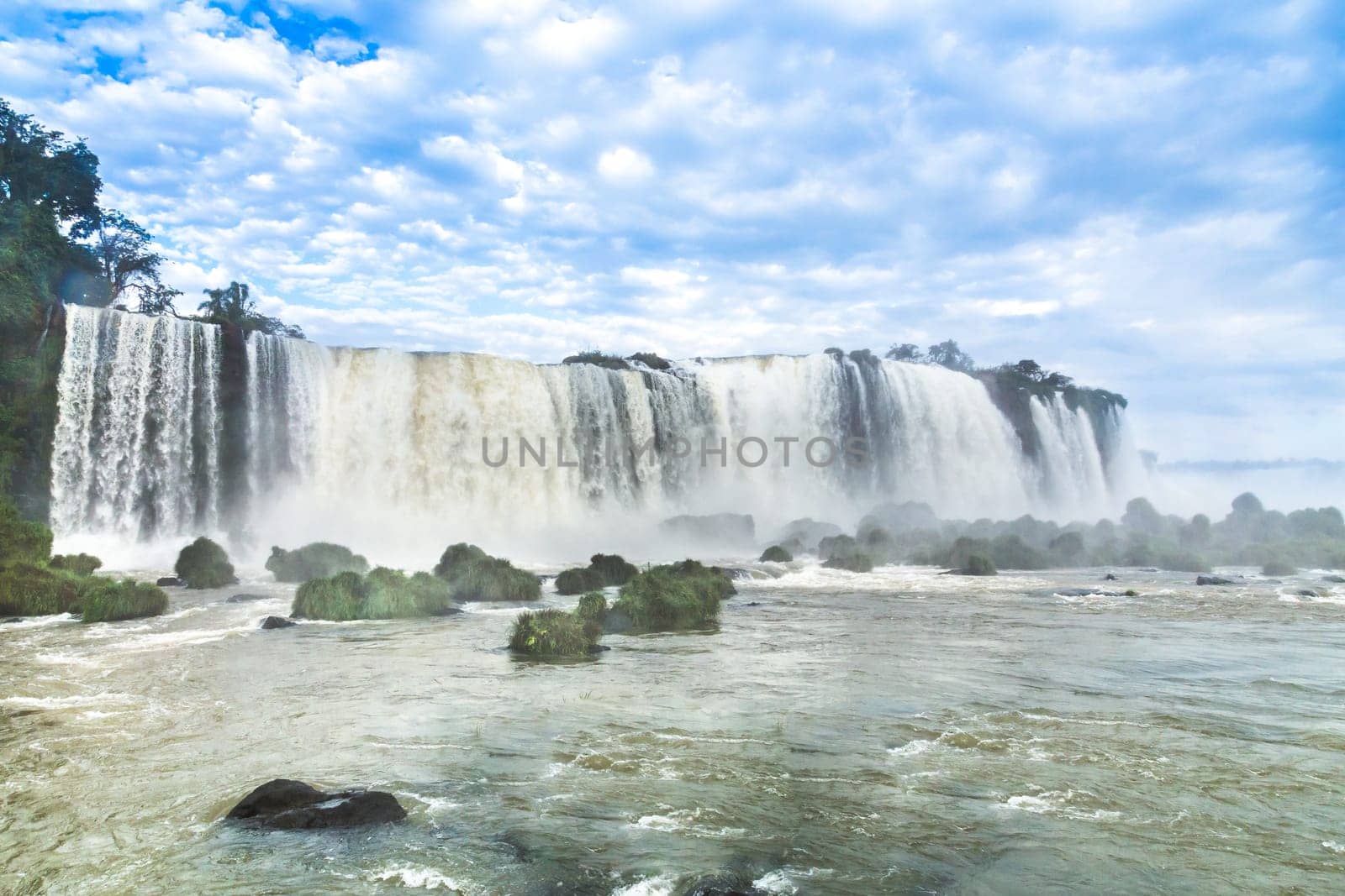 Tourists at Iguassu Falls at Iguassu National Park, World Natural Heritage Site by UNESCO