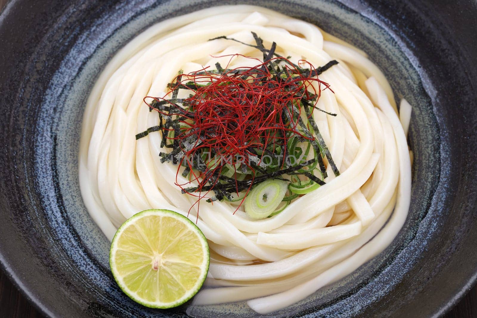 Close up of Japanese bukkake udon noodles in a bowl