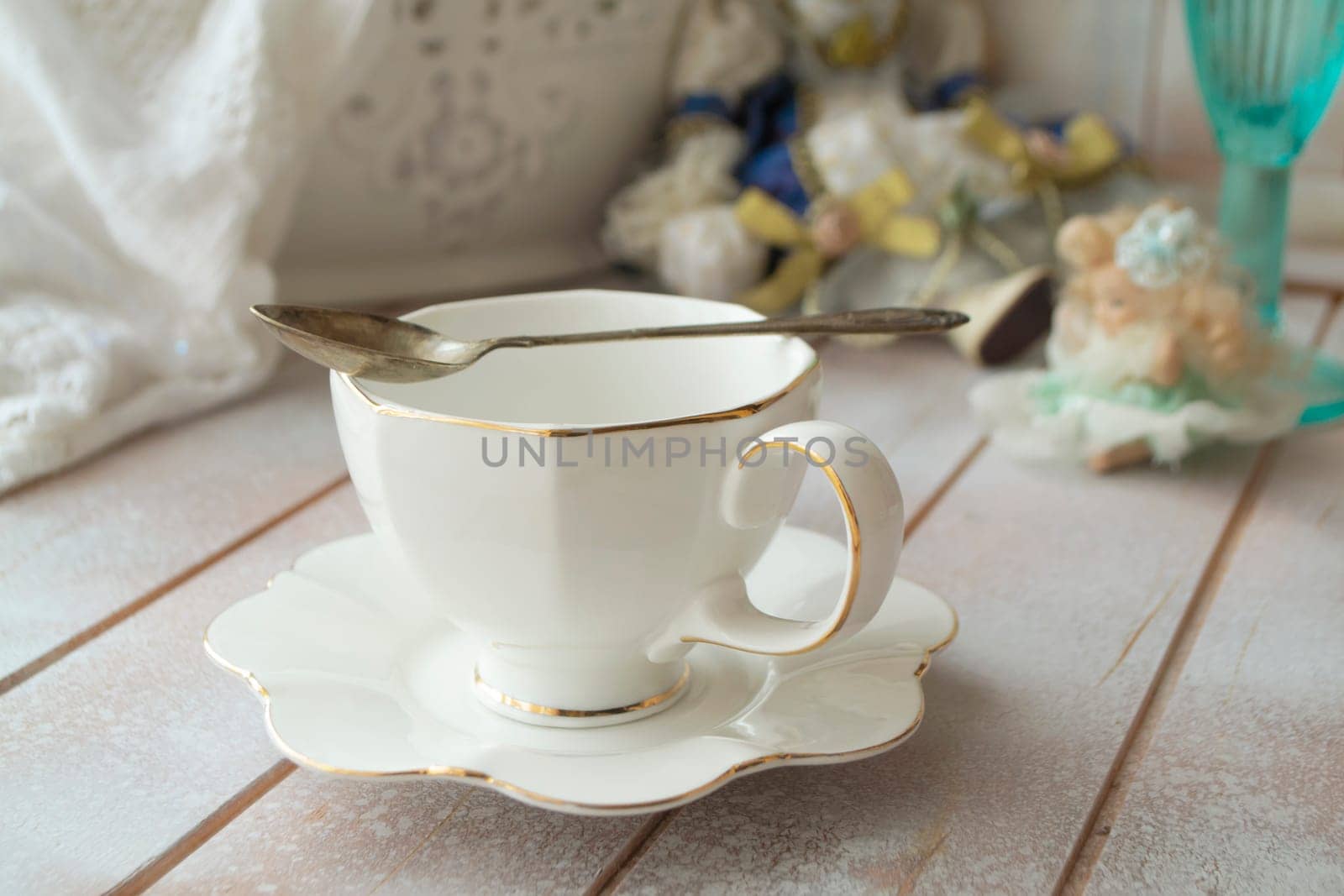 Closeup of white cup of tea on vintage wooden table