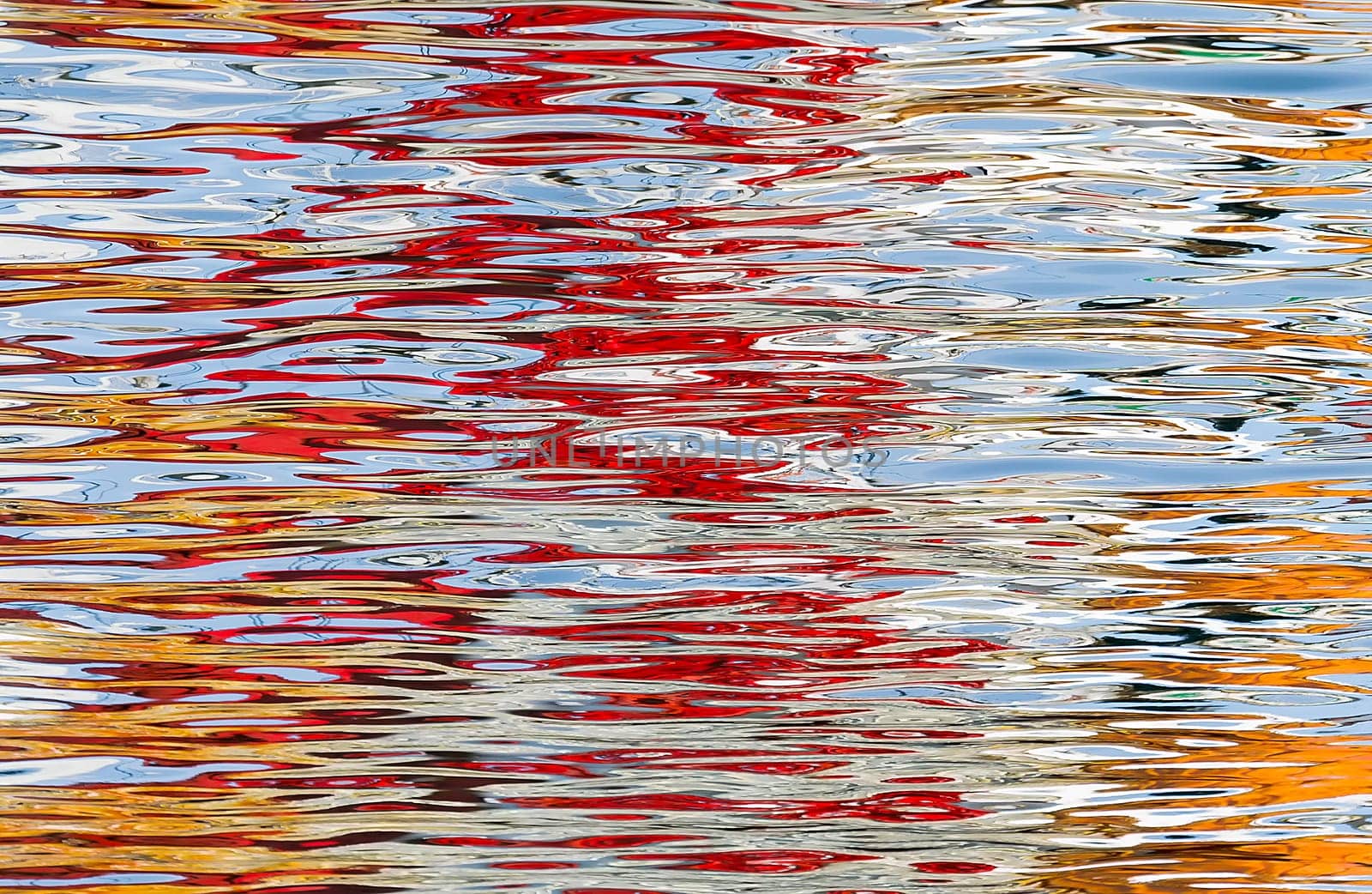 Color reflections in the water making an abstract image