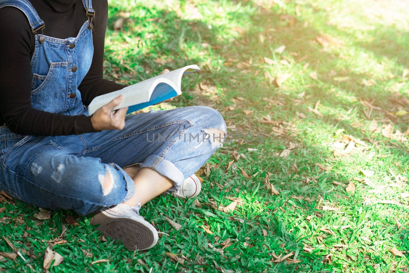 Young woman reading a book at home. Concept education