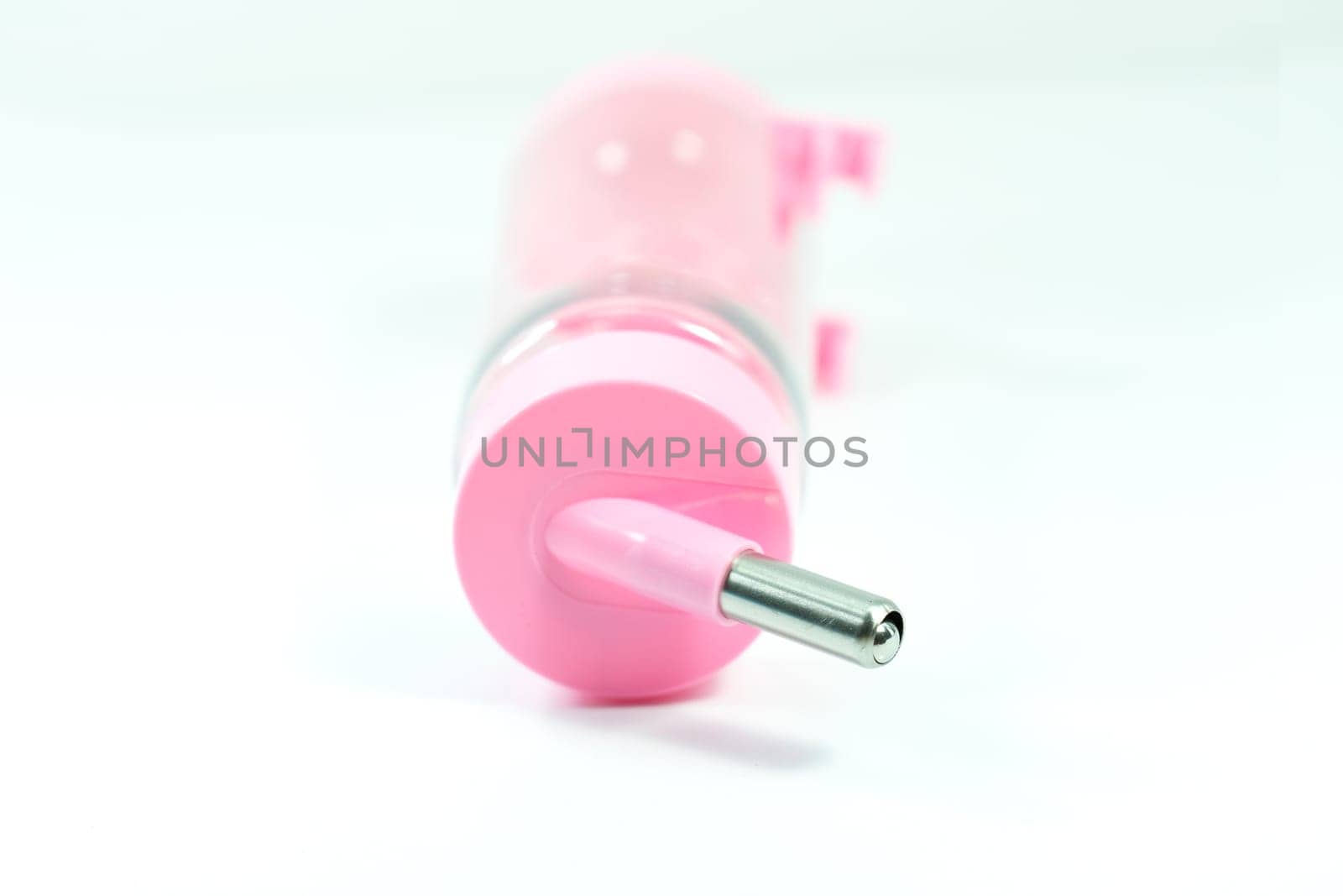Pet supplies about water feeder of pink for dog or cat isolated on white