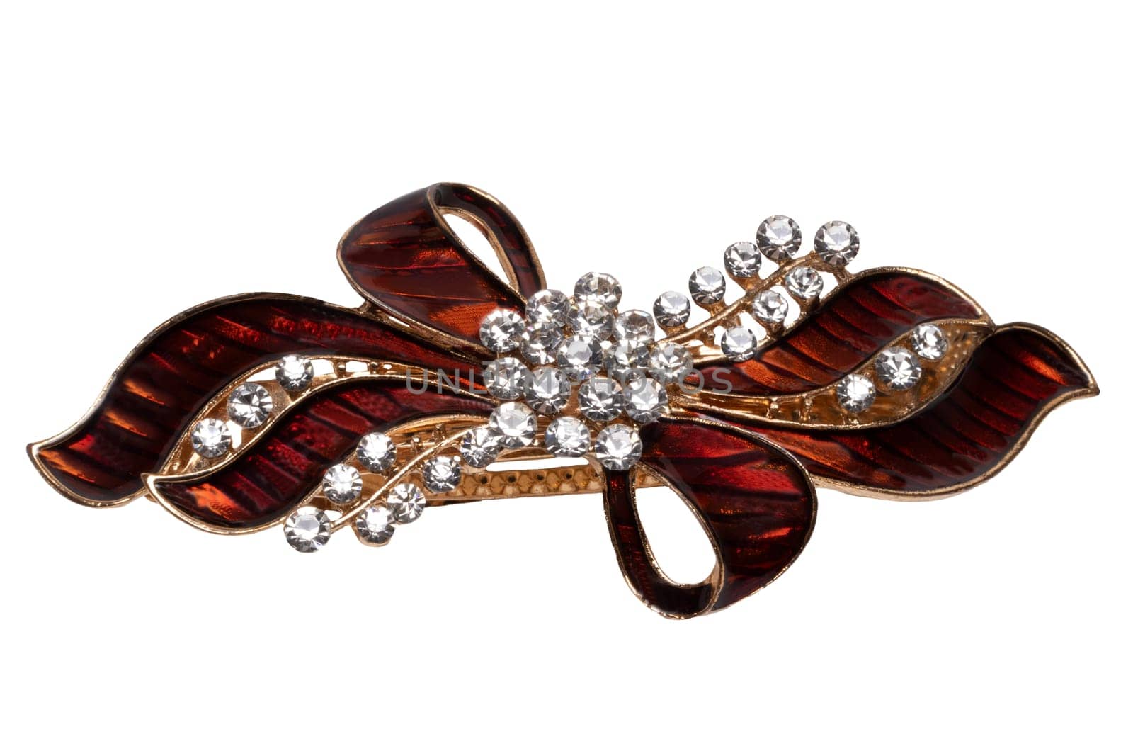 Close-up of a beautiful elegant luxurious hair clip or hair pin with rhinestones isolated on a white background. Macro photograph.