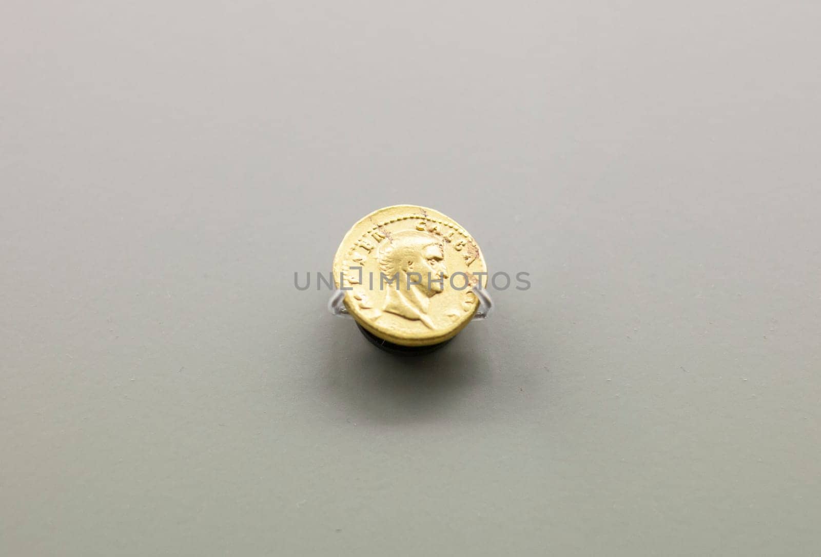 Merida, Spain - August 25th, 2018: Galba Roman emperor gold coin. National Museum of Roman Art in Merida, Spain