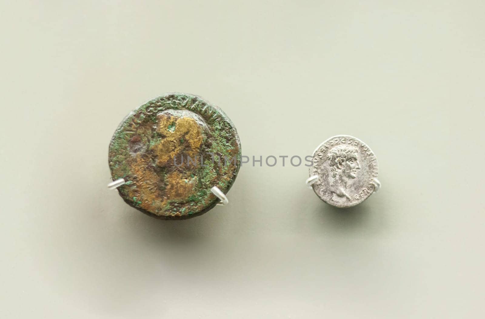 Merida, Spain - August 25th, 2018: Caligula Roman Emperor two coins, 37 AC, National Museum of Roman Art in Merida, Spain. Selective focus