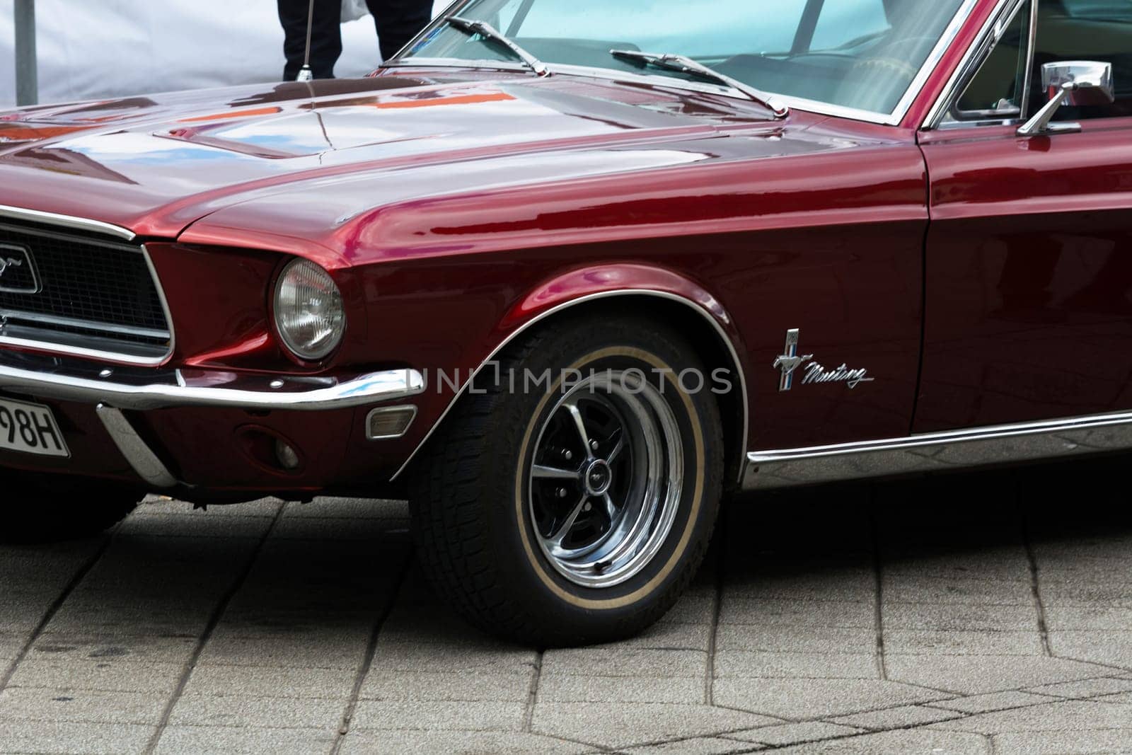 HEILIGENHAUS, NRW, GERMANY - SEPTEMBER 10, 2017:.Heiligenhaus, Nrw, Germany - September 10, 2017:.1966 Ford Mustang Side view in red color, parked in Heiligenhaus, Deutschland.