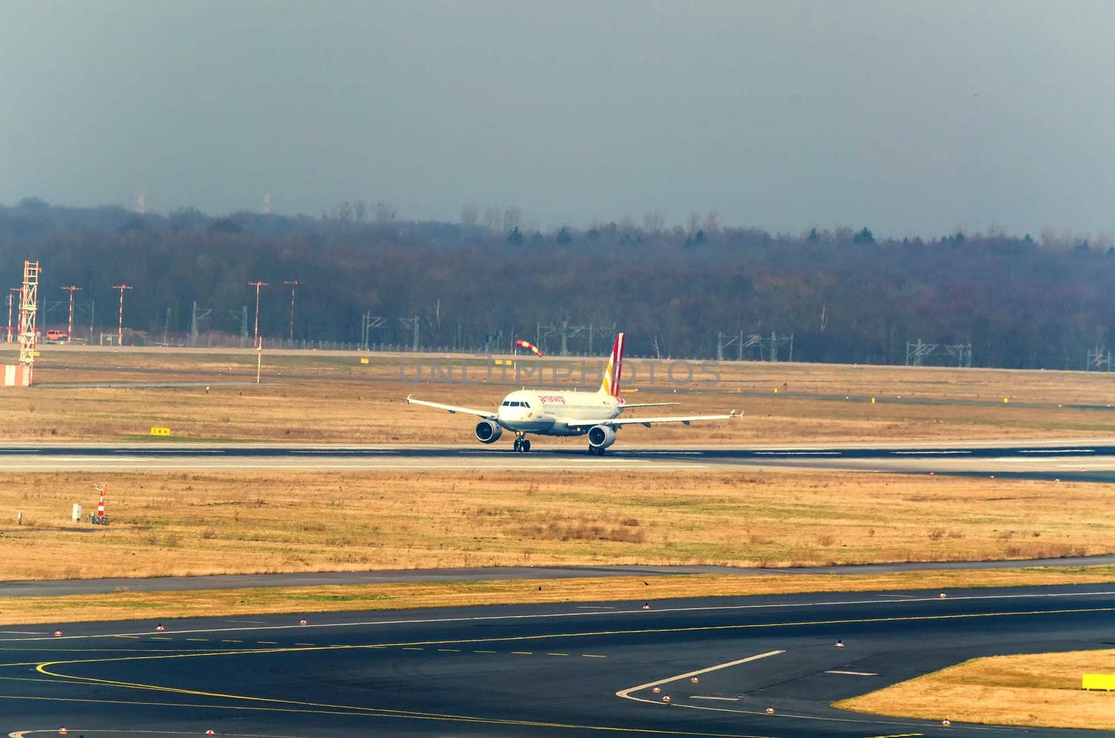 DUSSELDORF, NRW, GERMANY - MARCH 18, 2015:..Dusseldorf, Nrw, Germany - March 18, 2015:.Up, Airplane Dusseldorf. View of the tarmac. Large passenger airplane at the gate.