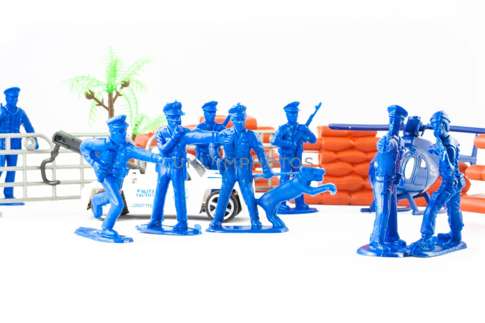 Little toys cop. Elicopter, policeman and policedog.
