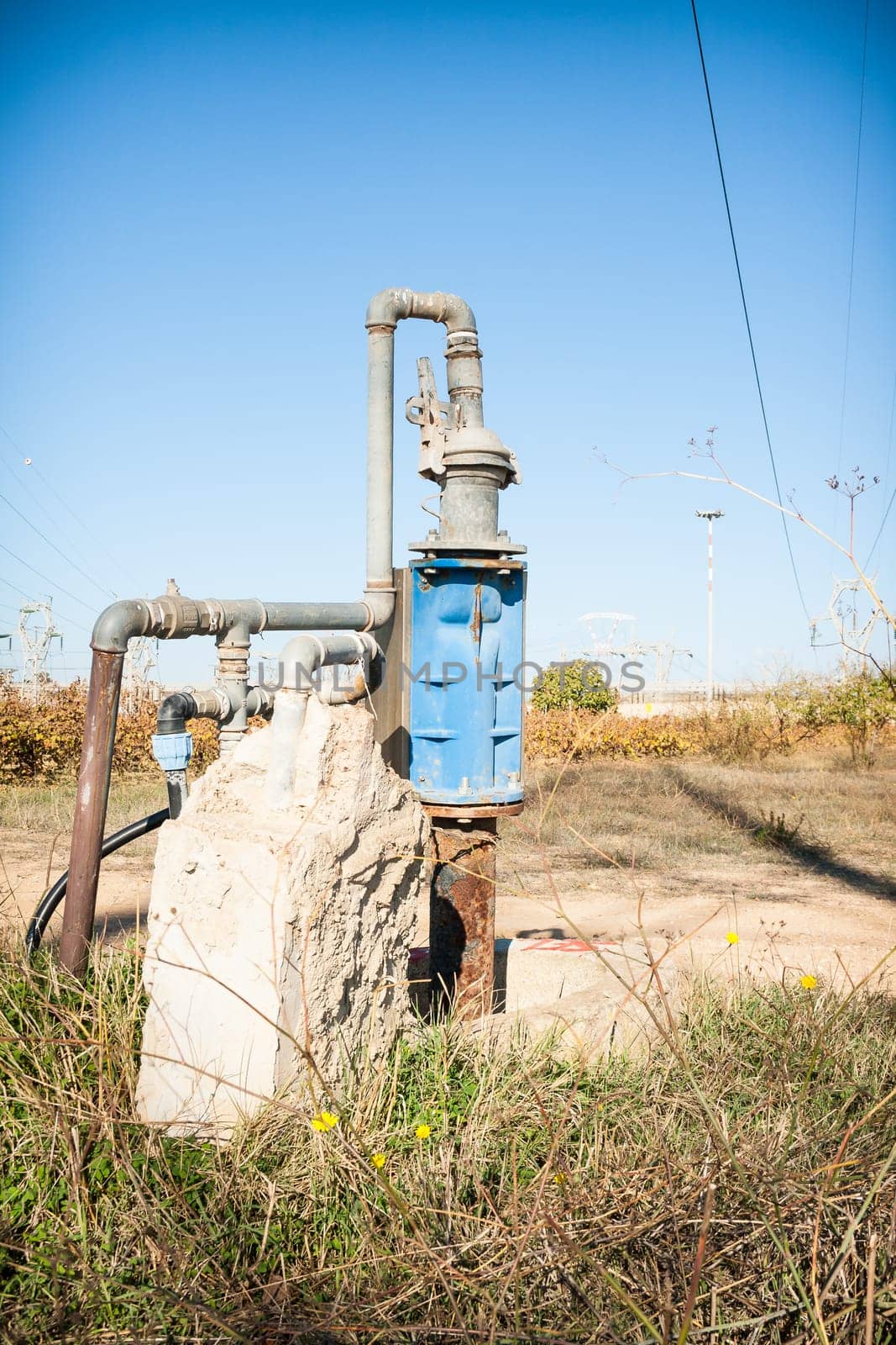 pipe connections in the countryside. Blue Cap