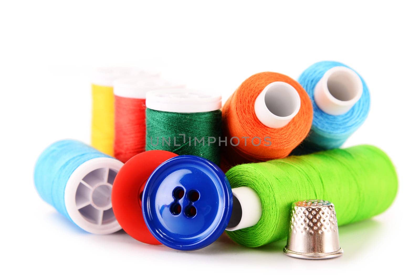 Composition with tailor threads isolated on white background