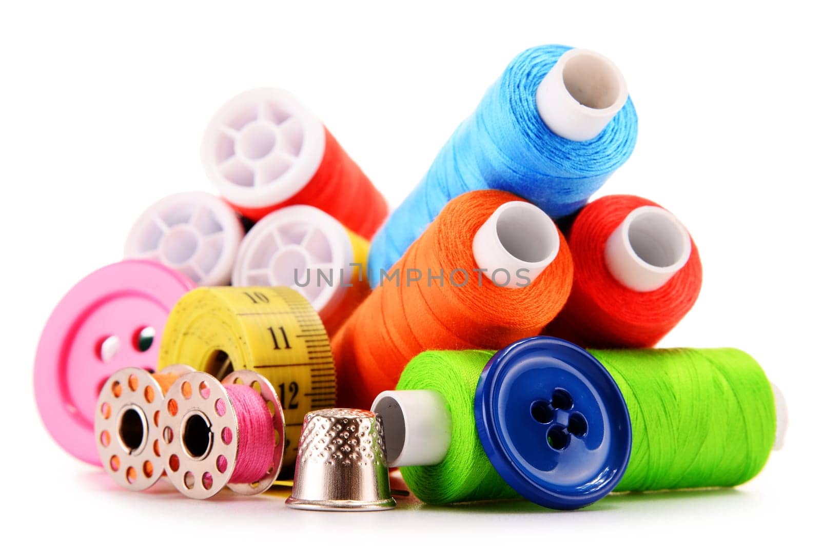 Composition with tailor threads isolated on white background